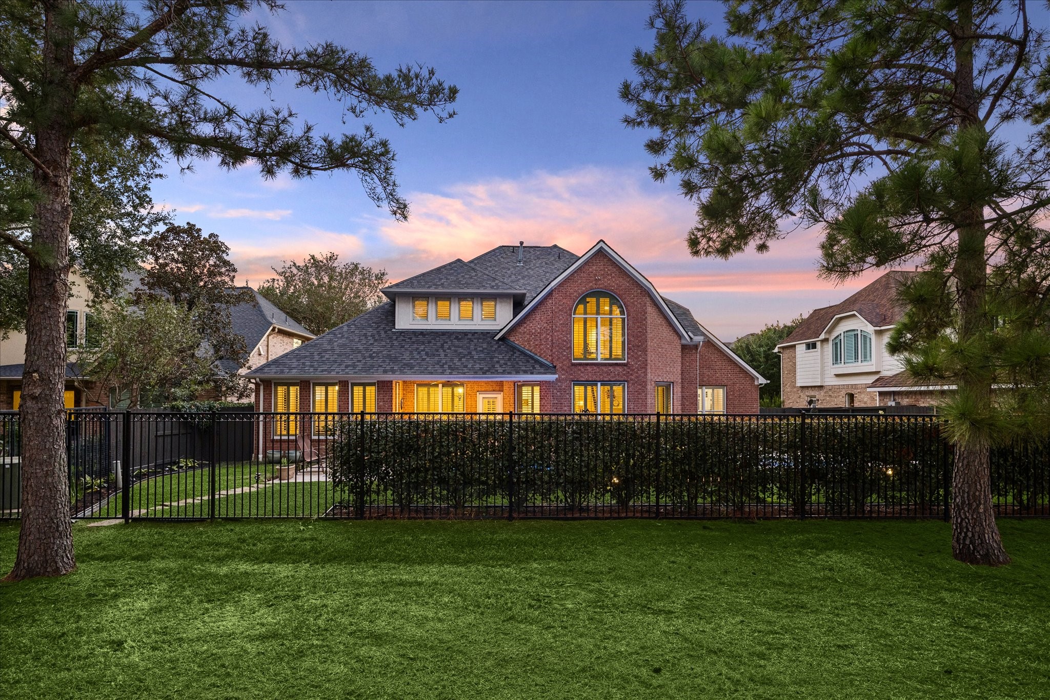 Mature landscaping provides privacy from the greenbelt.