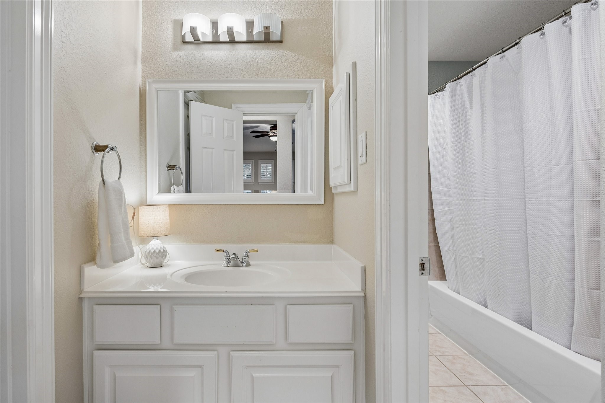 The opposite end of the Hollywood bath connects seamlessly to Bedroom 3, offering convenient access and a thoughtful flow between spaces.