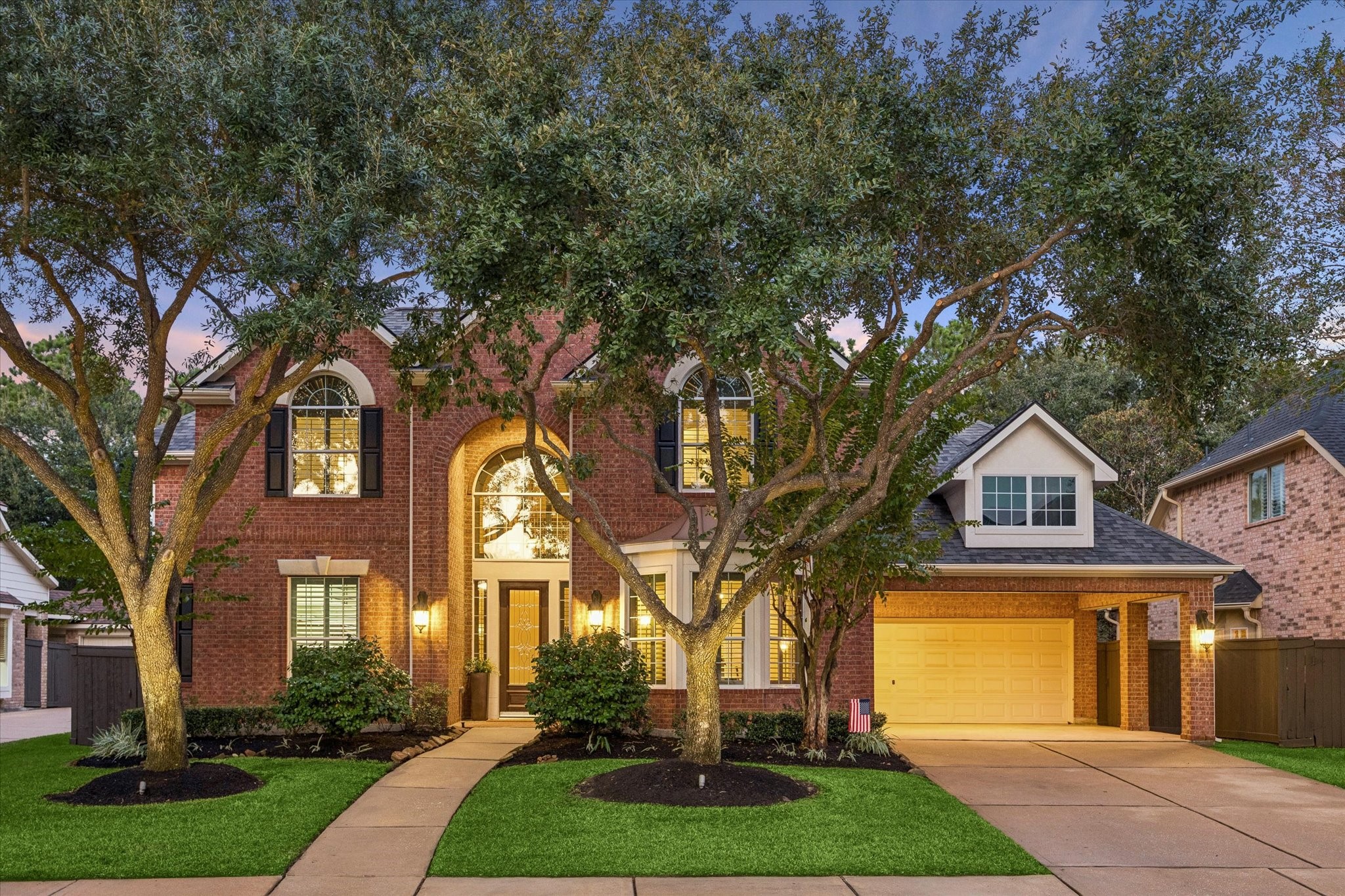 Enjoy impressive curb appeal, beautifully maintained landscaping, and mature trees that create a welcoming first impression. A porte-cochre and attached two-car garage provide ample parking and added convenience.