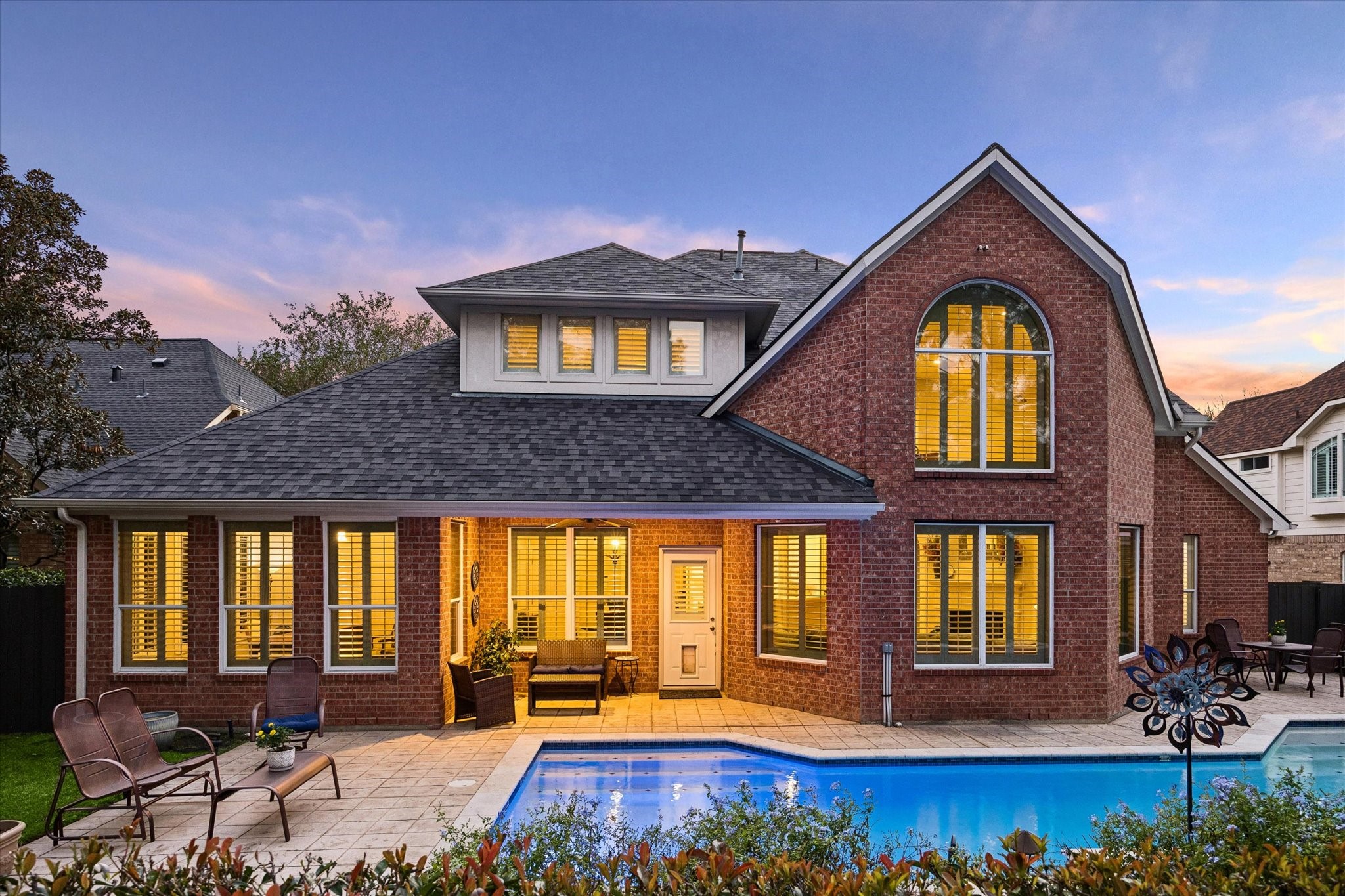 The covered patio is an inviting extension of the home designed for relaxing, entertaining, and enjoying the outdoors.