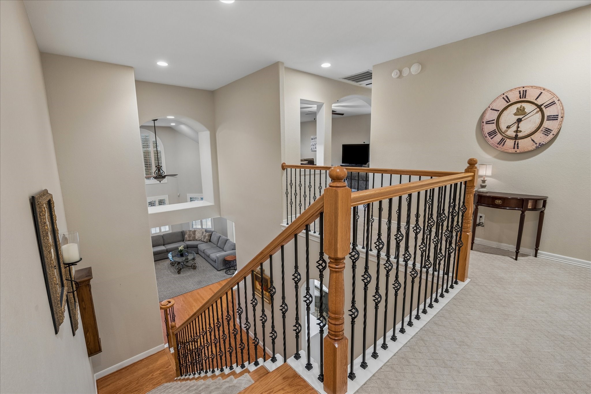 The upstairs landing offers a bright, inviting feel, with a catwalk overlooking the floor below and creating an open connection between levels.