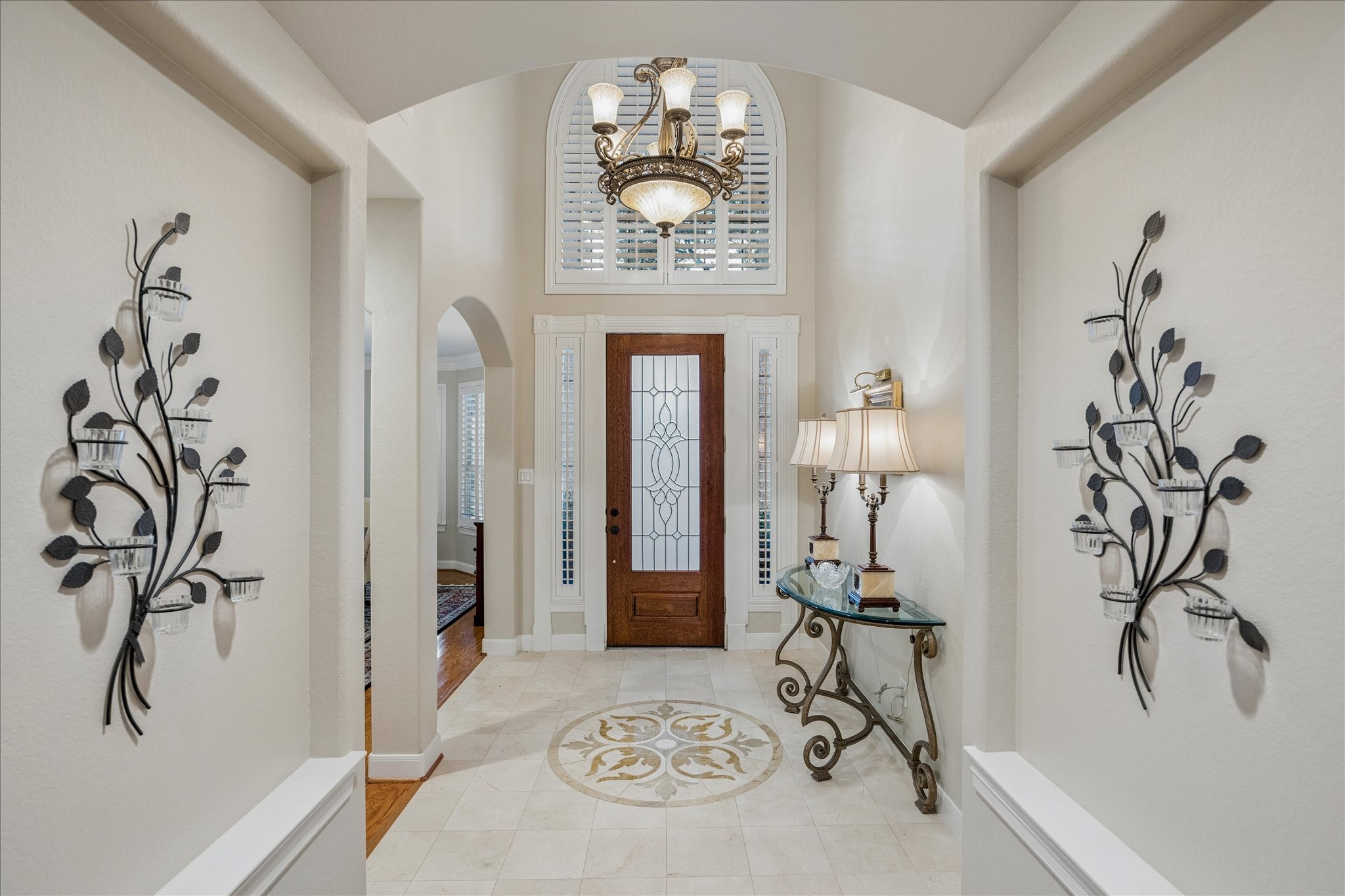 Niches and stylish tiling greet you as you enter the foyer with formal dining room.