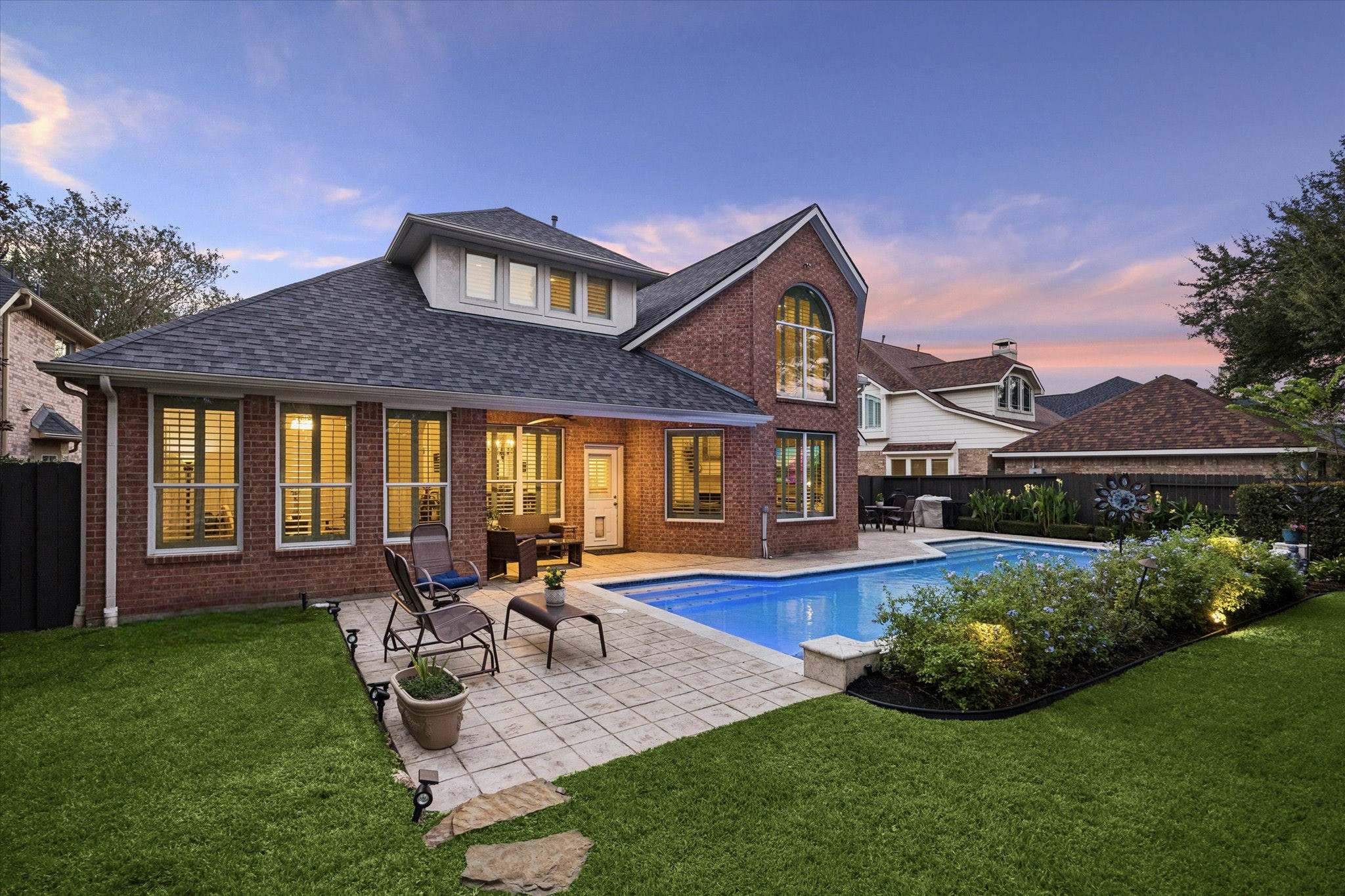 Step outside through your covered patio to your beautifully landscaped backyard featuring a large deck and ample greenspace.