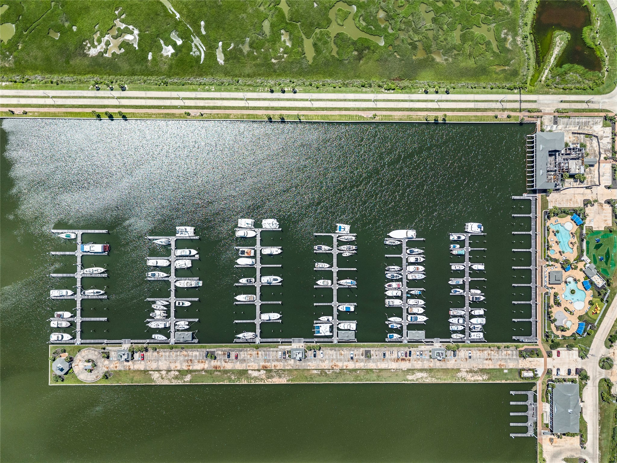 Harborwalk Yacht Club Membership is included with the property for premium marina access.