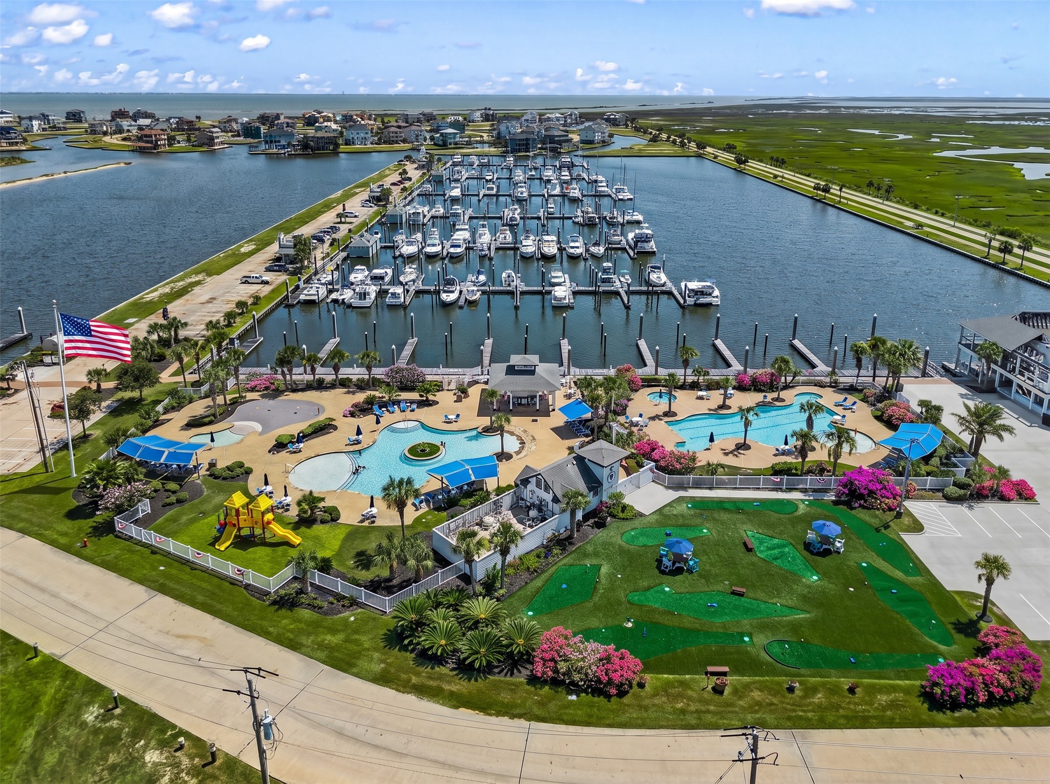 On land, residents enjoy resort-style pools, a fitness center, lighted tennis courts, putt put golf, a playground, kayak launches, private fishing piers, and miles of hike and bike trails through wetlands and green spaces.