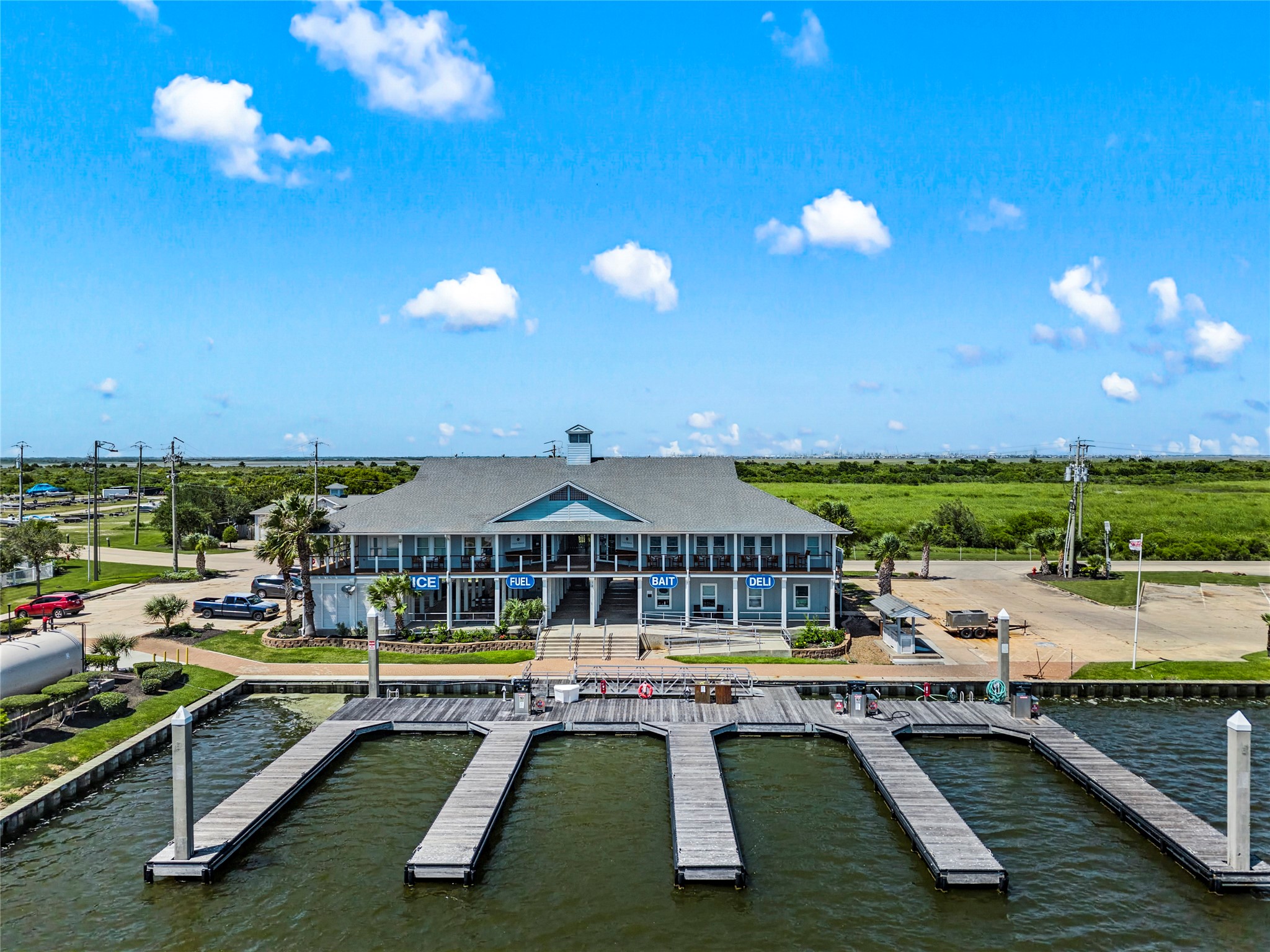 Amenities available to residents include a full service marina with 180 aluminum truss floating slips accommodating vessels up to 125 feet, a two lane boat launch, fuel station with marine grade diesel and 93 octane gasoline, live bait system, and a ships store with deli and provisions.