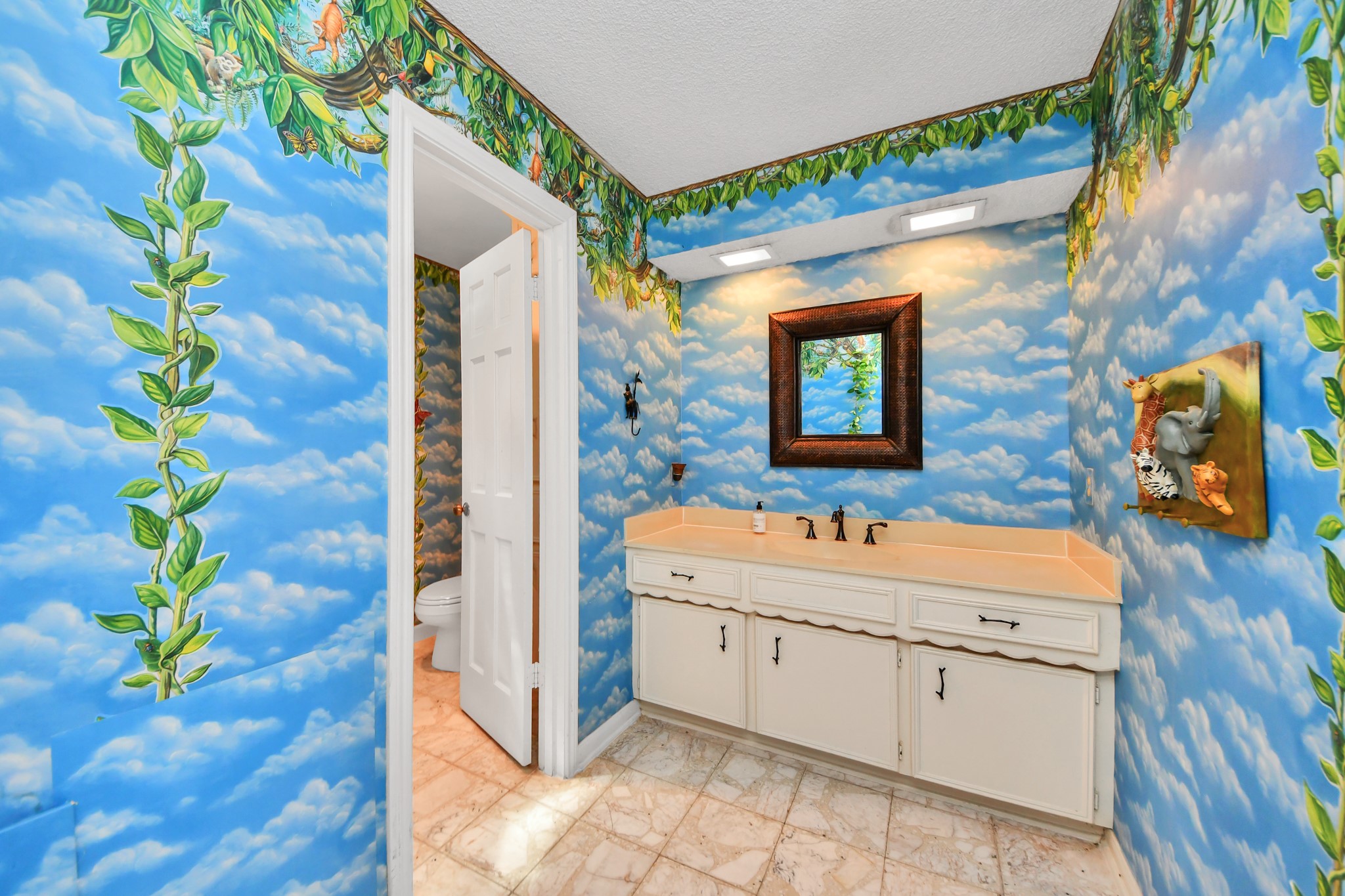 Another guest full bath up adds a playful touch along with a long vanity and plenty of storage. Great space here. Reconfigure the SF and make a fabulous en suite!