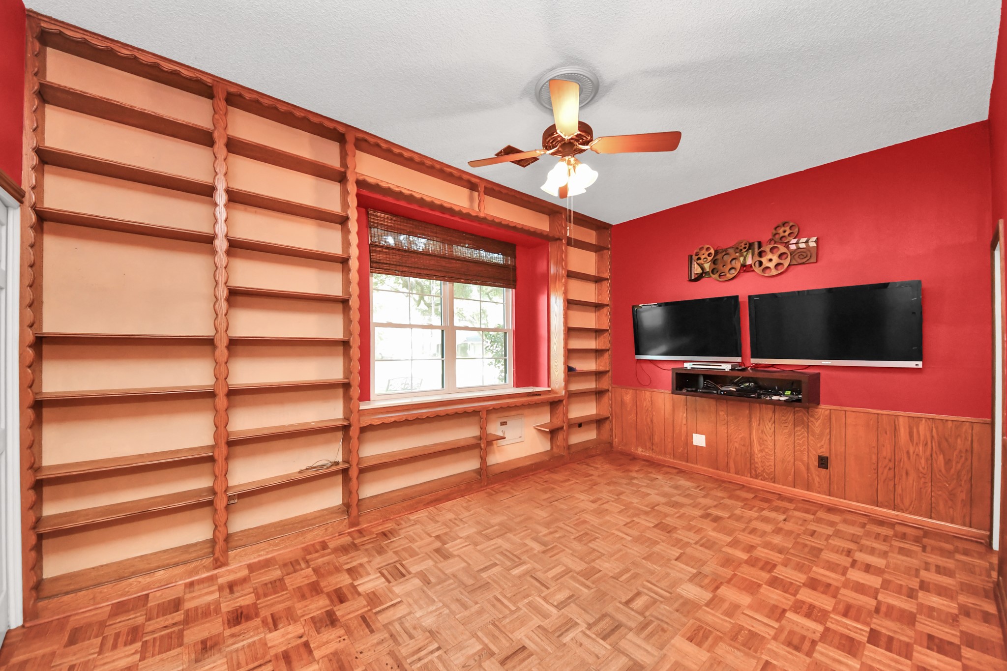Custom built-ins maximize storage and showcase the thoughtful details found throughout the home. This could be play room, media, second bedroom down (it features a closet and access to a full bath!), flex room, you name it.