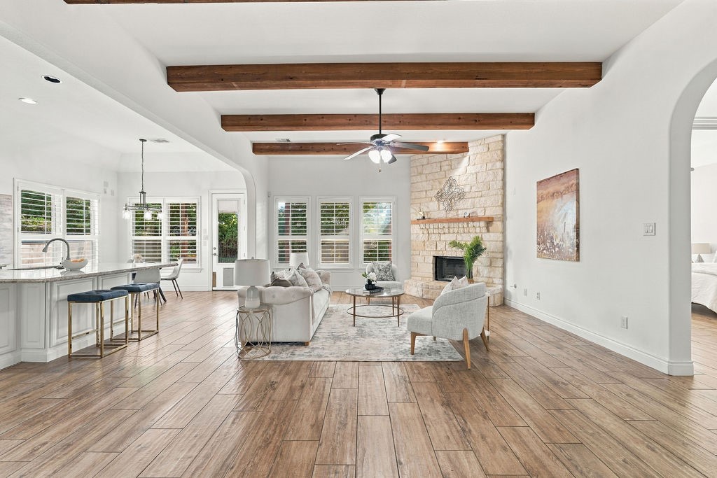 The open living area features gorgeous wood-beam ceilings and tons of natural light. The open living area features gorgeous wood-beam ceilings and tons of natural light.