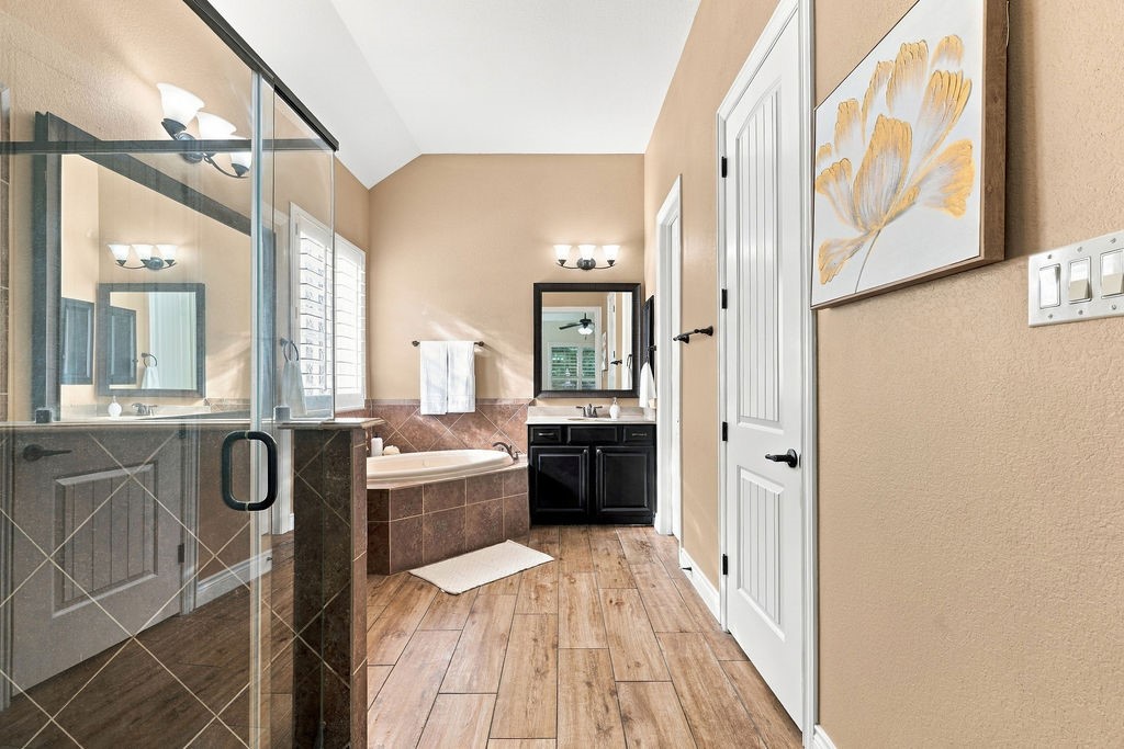 Spa-like primary bathroom with a long double vanity and great storage.