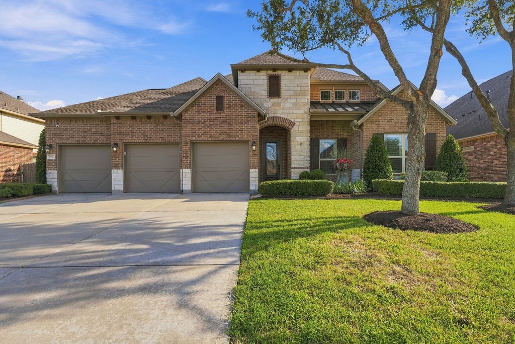Beautiful curb appeal with a gorgeous stone and brick facade welcomes you home. Beautiful curb appeal with a gorgeous stone and brick facade welcomes you home.