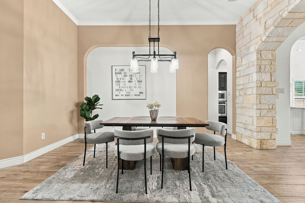 Cozy dining nook framed by a beautiful stone archway. Cozy dining nook framed by a beautiful stone archway.