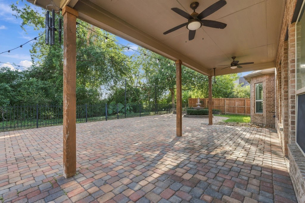 Step out to the covered back porch, complete with ceiling fans to keep you cool on warm days.
