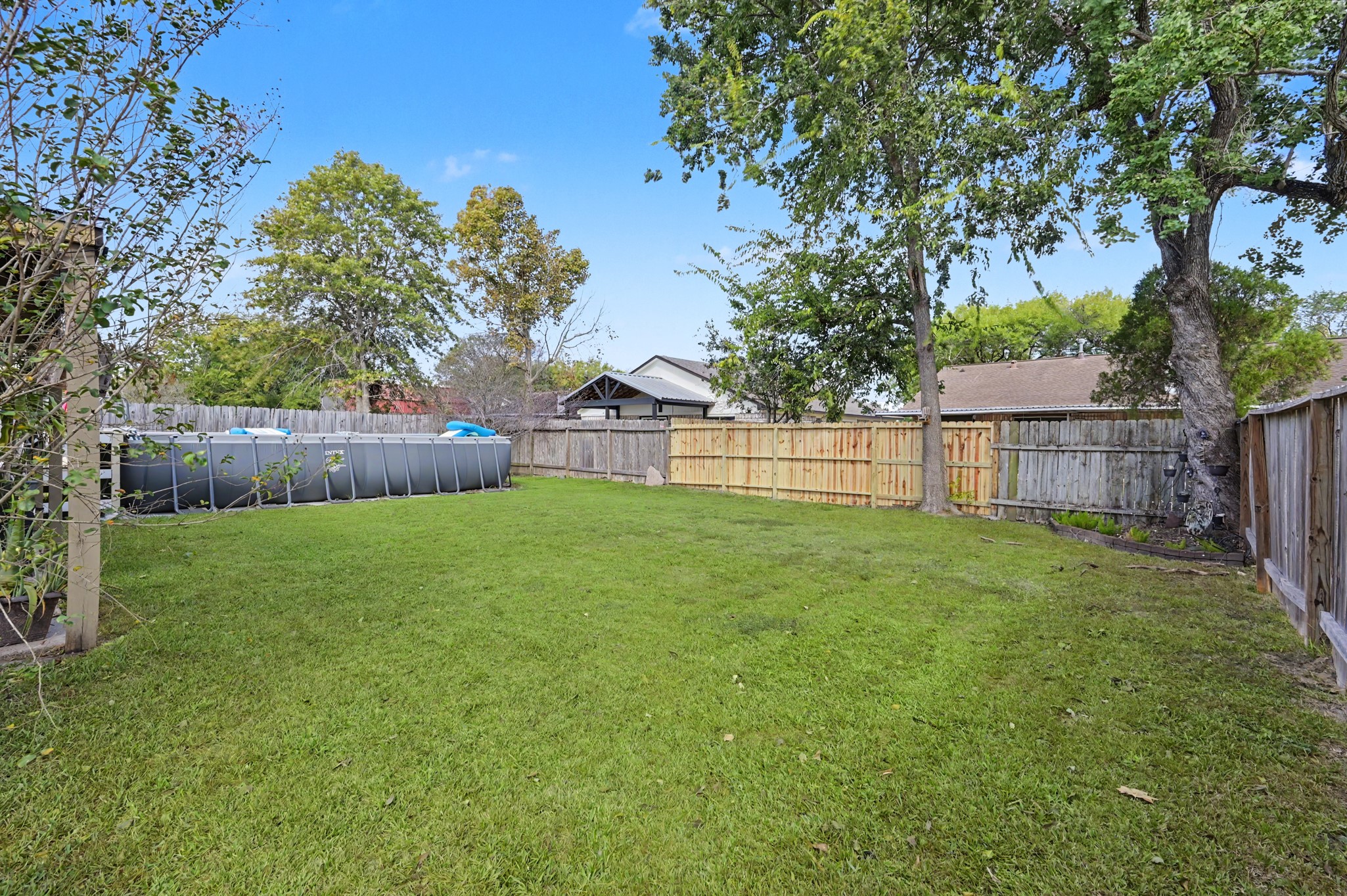 Spacious backyard perfect for outdoor relaxation and entertaining.