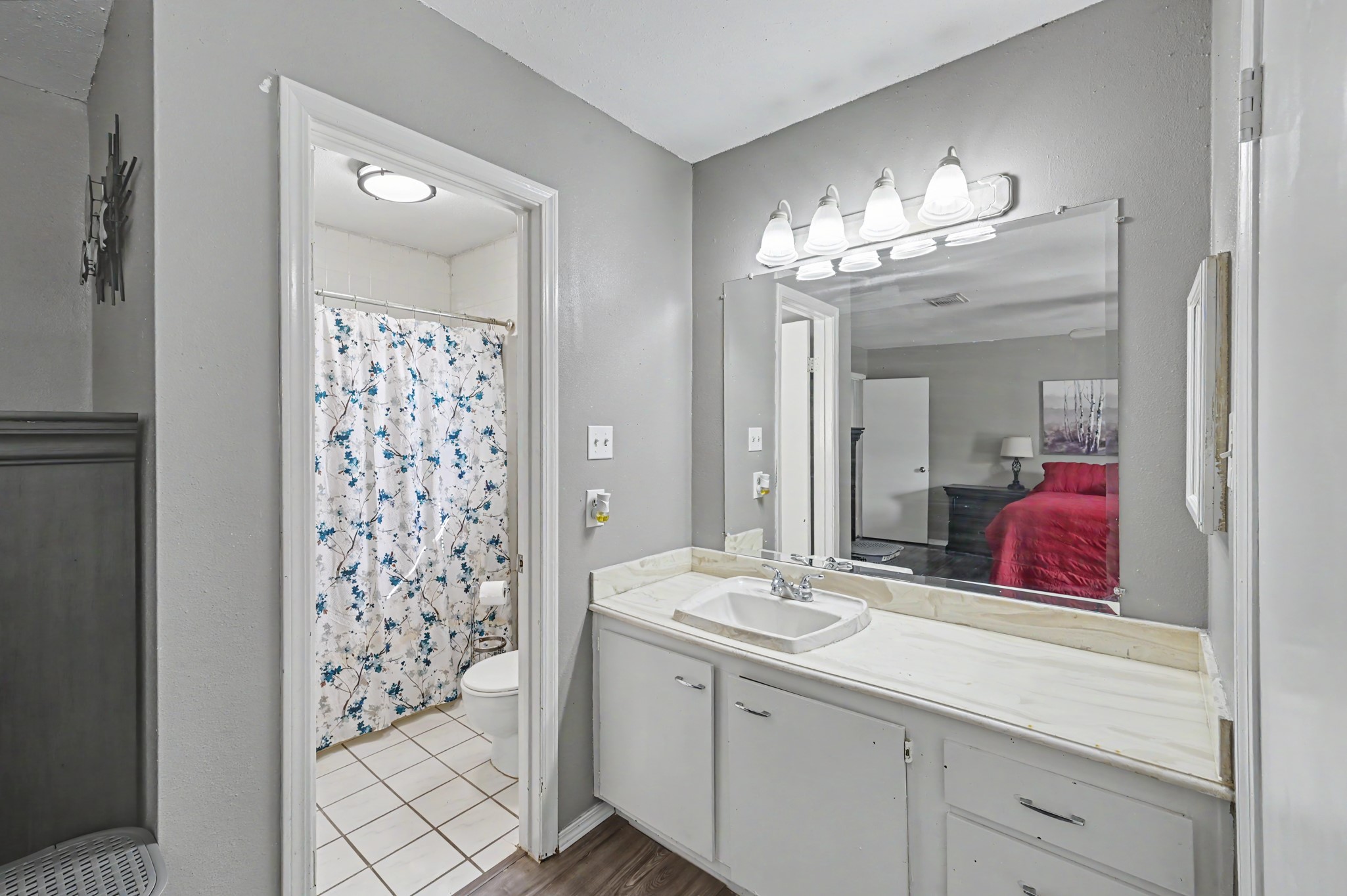 Primary bathroom with updated fixtures and spacious vanity.