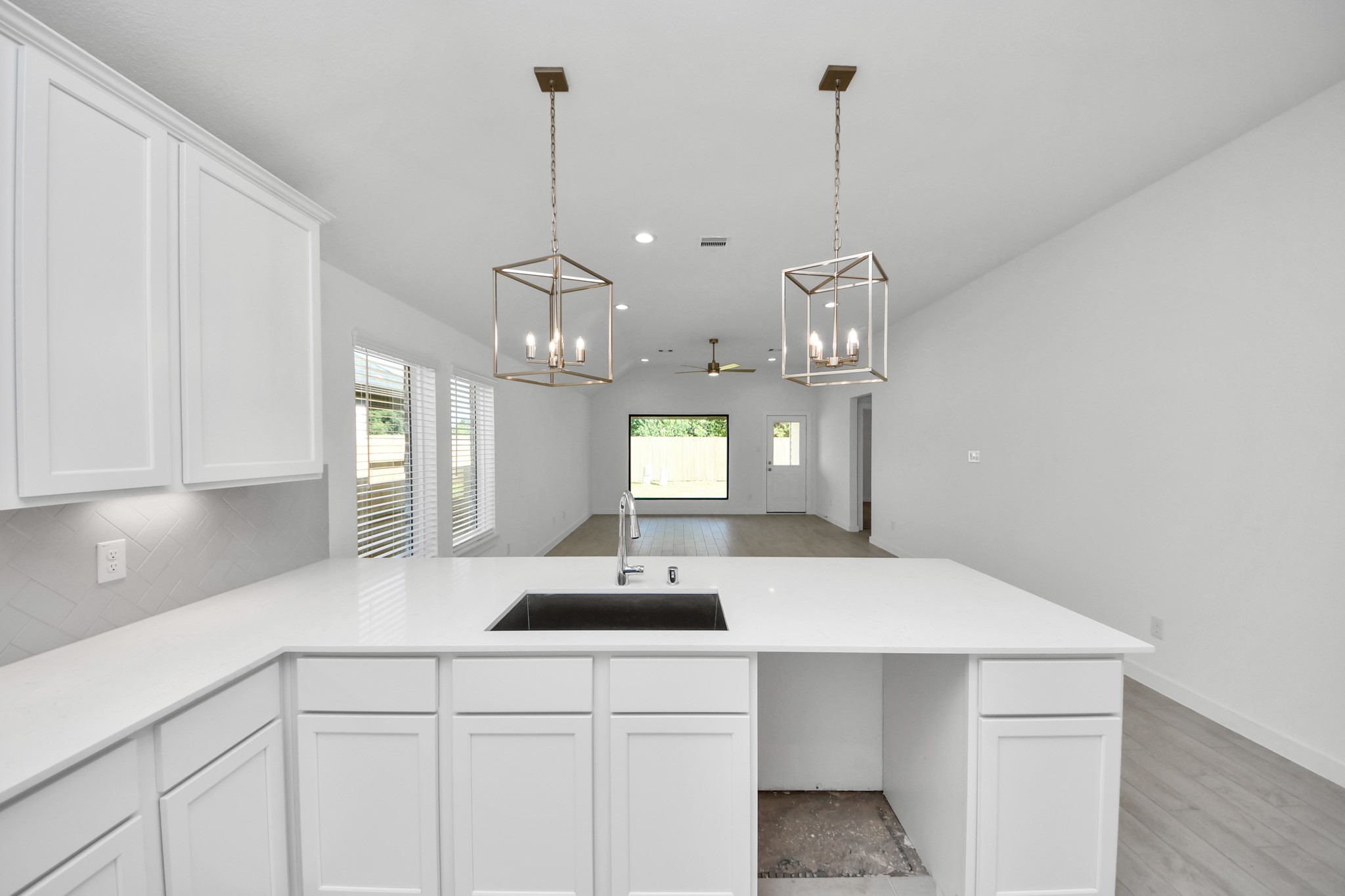 All of this overlooks your expansive family room, creating a perfect space for culinary delights and family gatherings. Sample photo of completed home with similar floor plan. Actual colors and selections may vary.