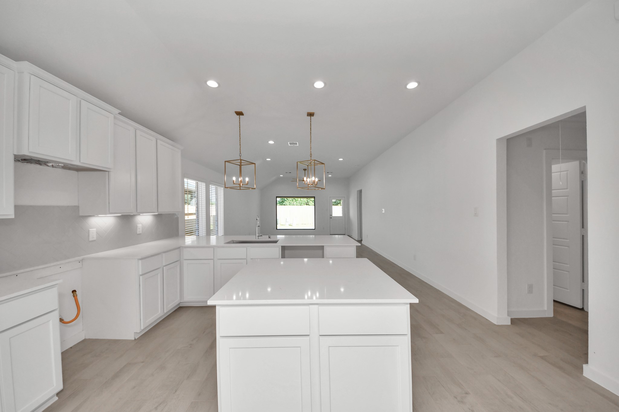 The extended counter area adds both practicality and style, making meal preparation a breeze. Every detail is thoughtfully designed to enhance the kitchen's functionality and aesthetic appeal. Sample photo of completed home with similar floor plan. Actual colors and selections may vary.