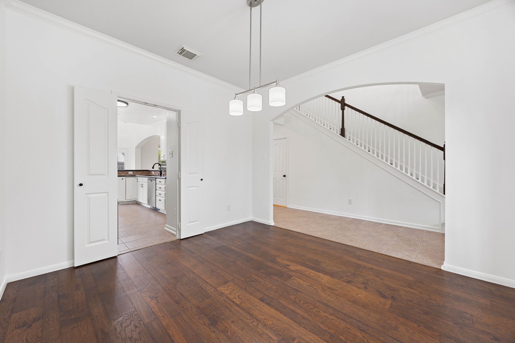 Additional dining room view showcasing the open layout and convenient connection to the foyer and main living areas.
