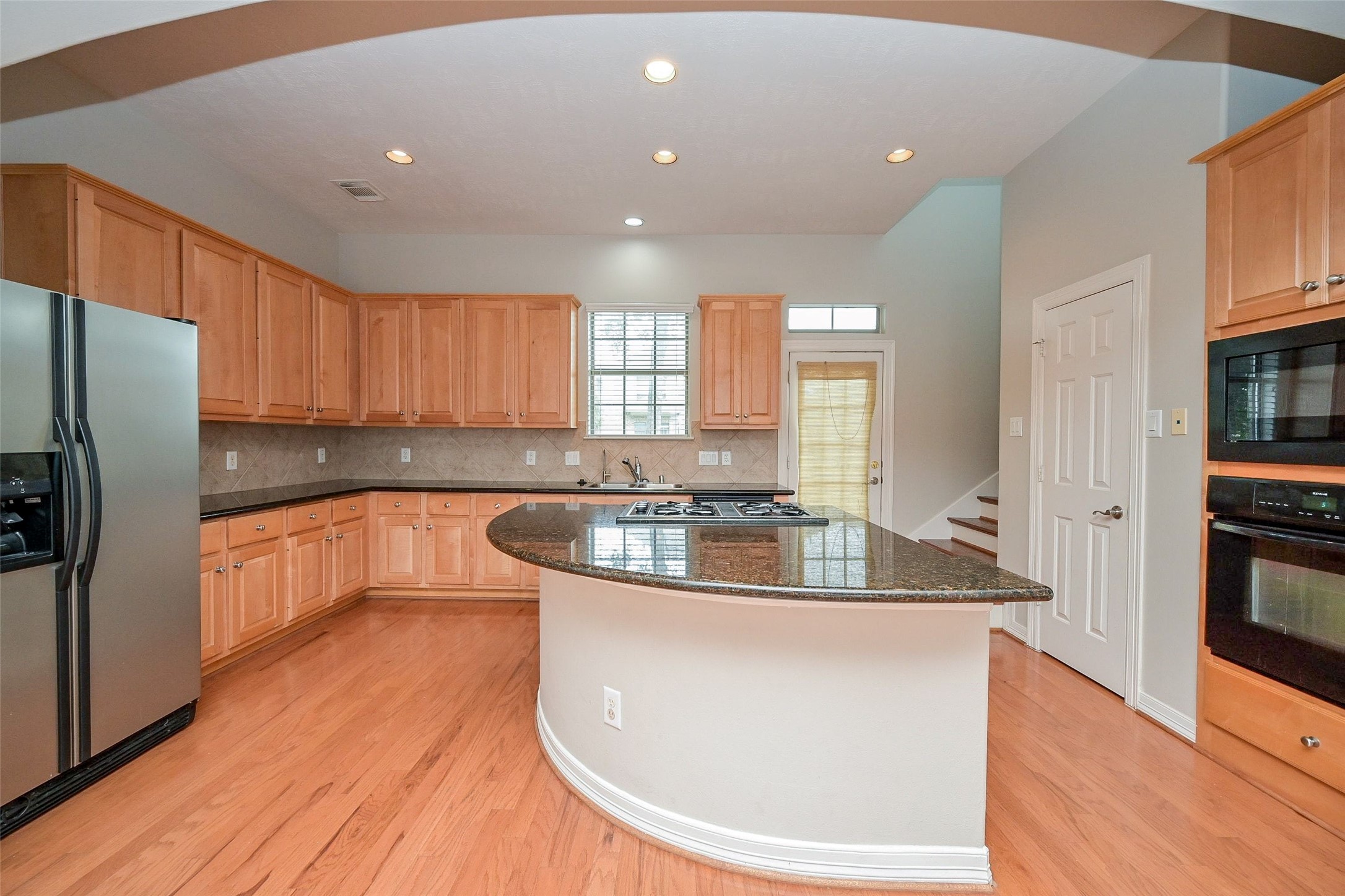 Kitchen with Island that's open to the Living Room, great for Entertaining.