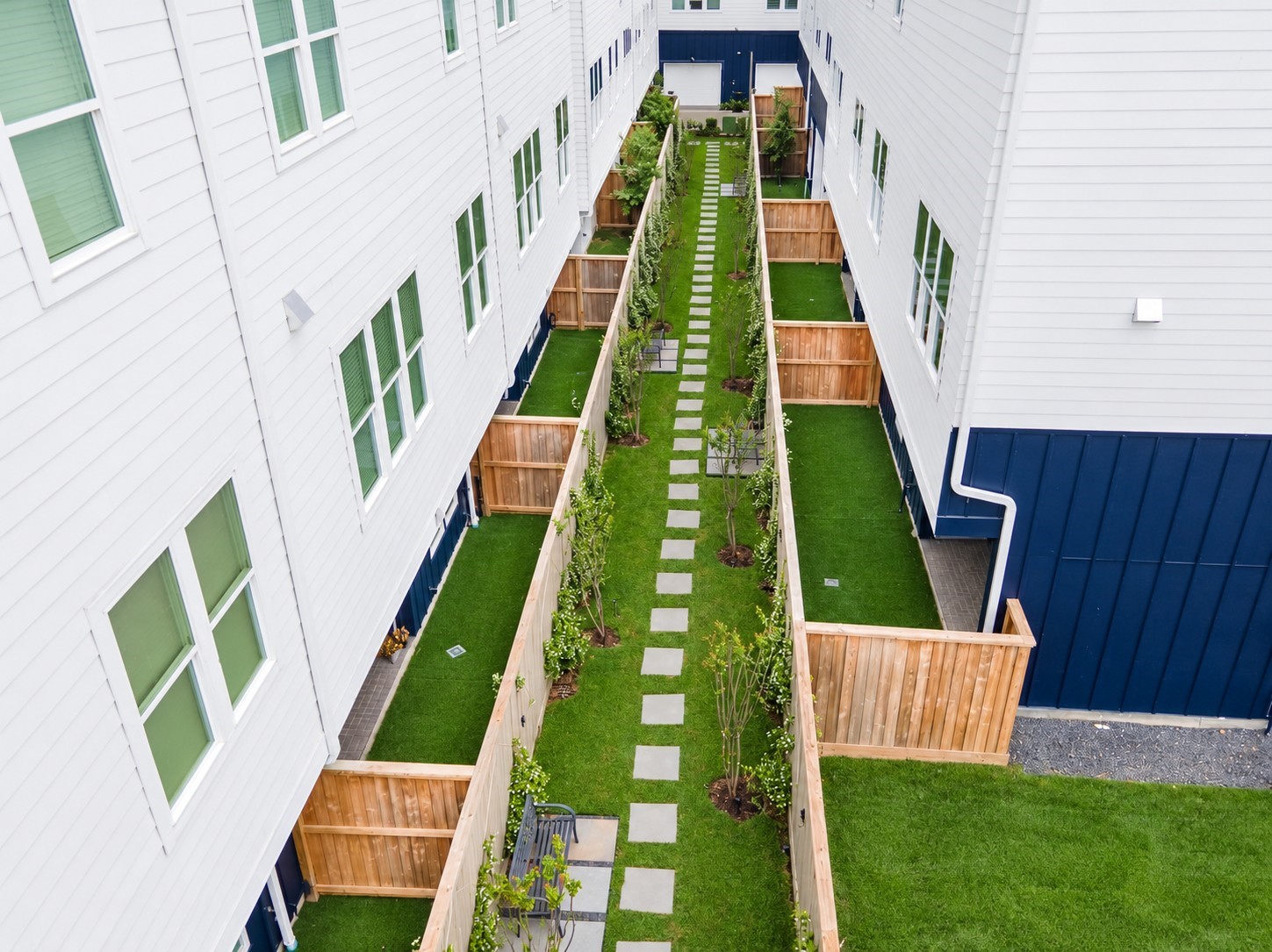 Courtyard area behind your private fenced in back yard.  Walk the dog or sit on a bench and relax.
