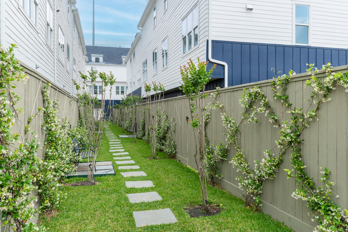 Close-up of the courtyard area.   Walk the dog or just relax on a bench for some quiet time.  Back yard gates open into this common area.