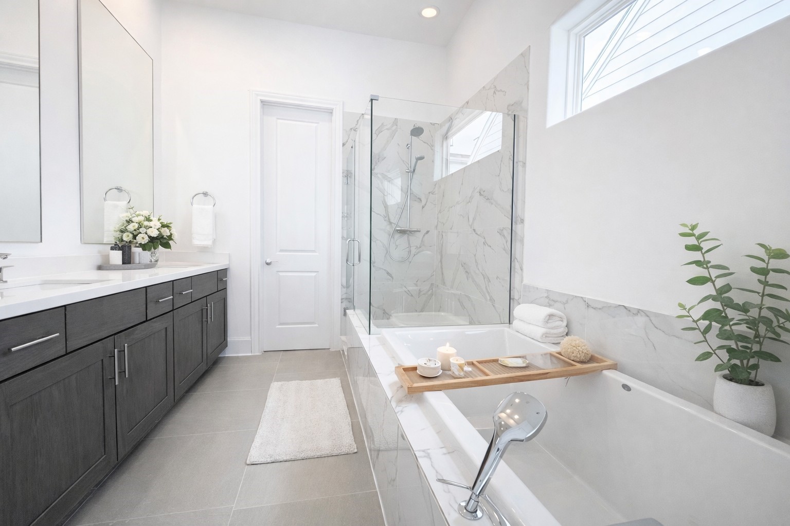 Frameless shower door, 6' tub, (not freestanding), and separate toilet room.
Similar plan and finishes.