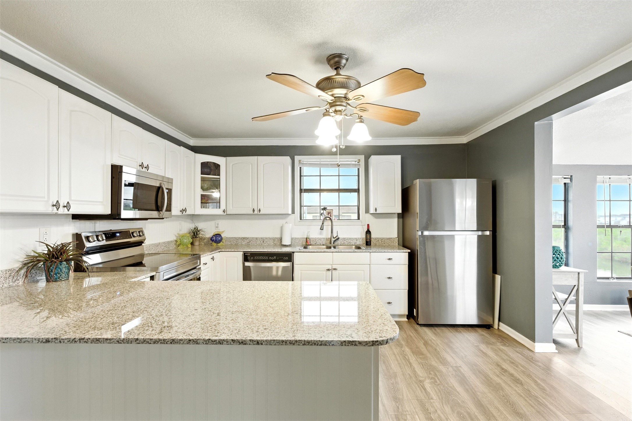 Large kitchen with all new stainless steel appliances that are included