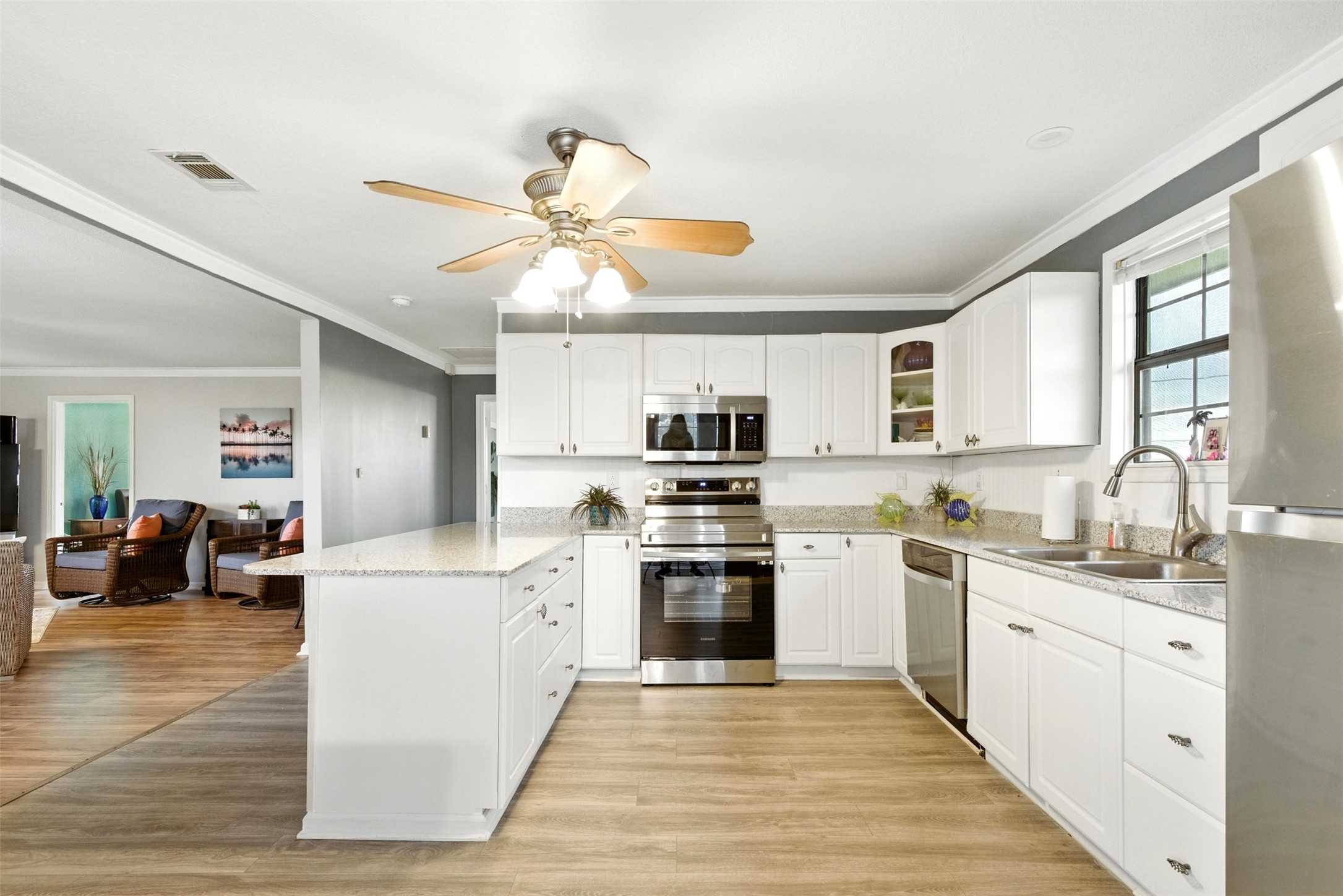 another view of kitchen that is open to family room