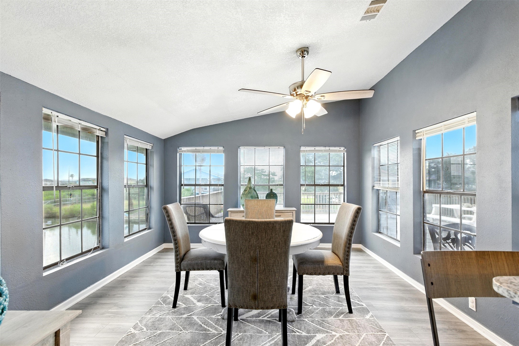 the dining room has natural light and waterviews