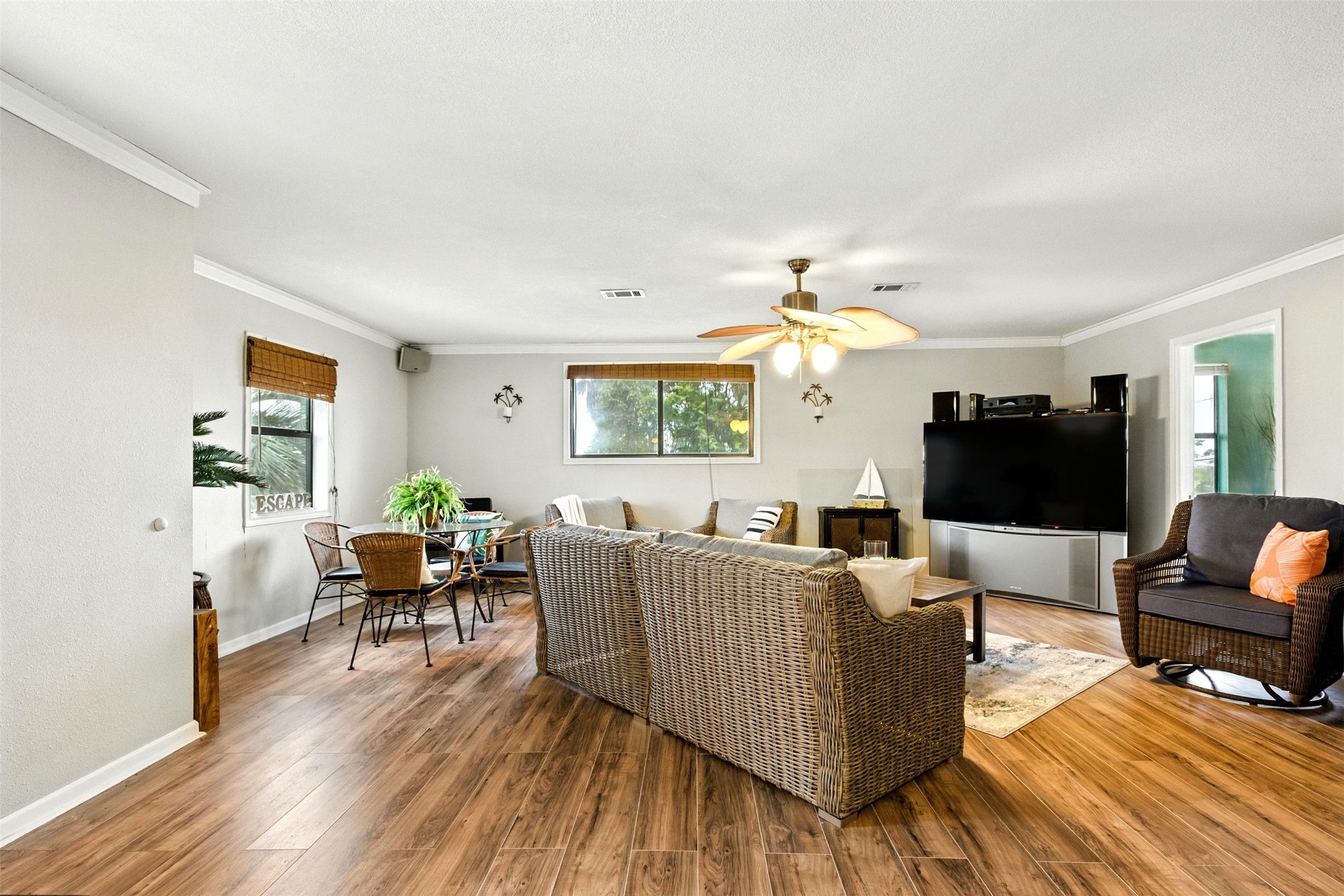 family room with beautiful luxury vinyl plank flooring that is waterproof