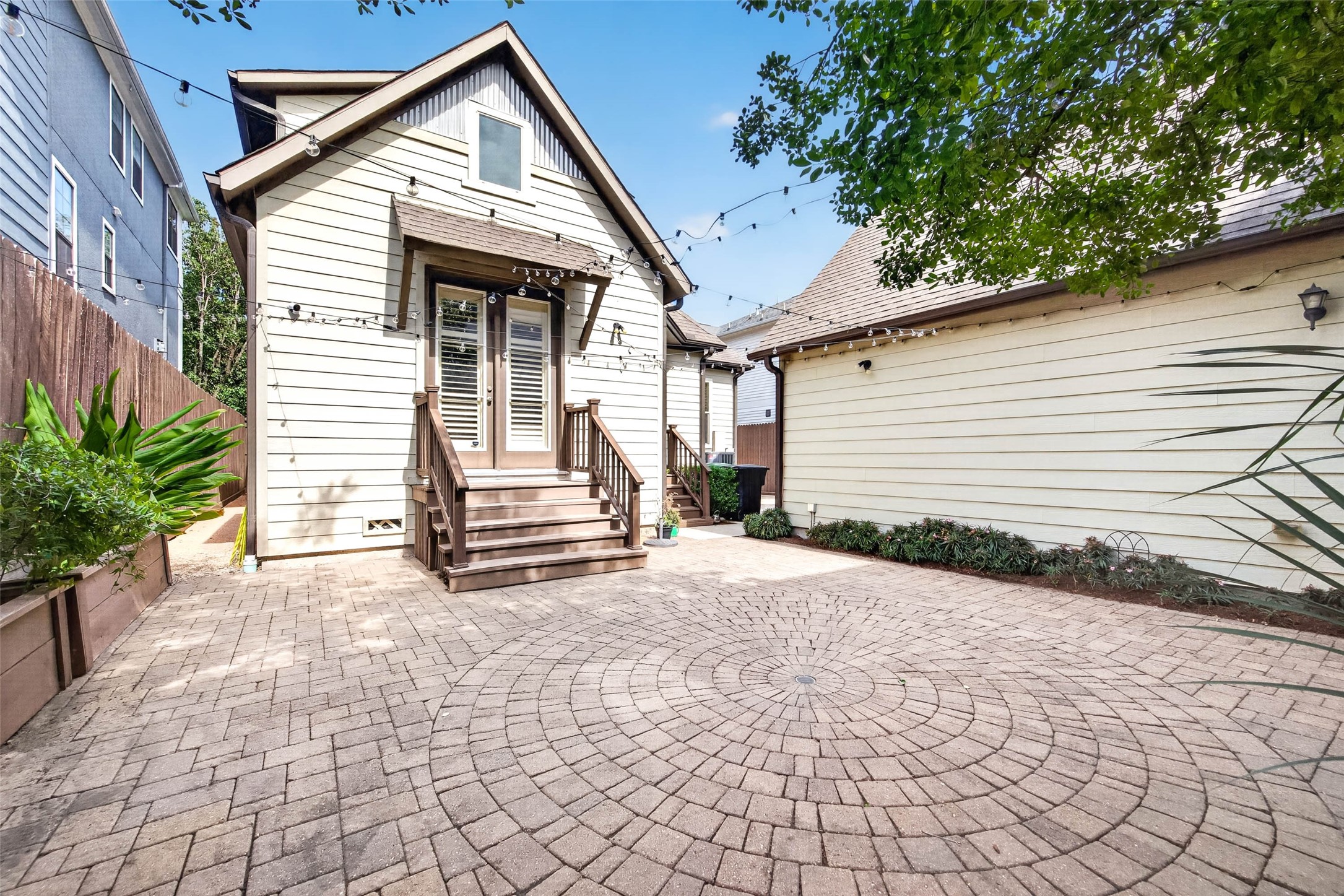 The detached garage at the rear of the property provides convenient parking while adding an extra layer of privacy to the backyard.