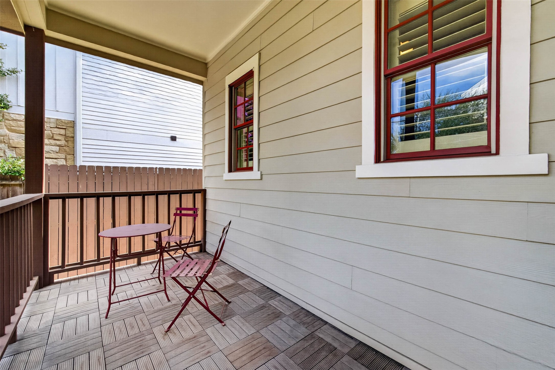 A closer look at this spacious front porch, showcasing the inviting sitting area and charming details that make this home feel so welcoming from the moment you arrive.