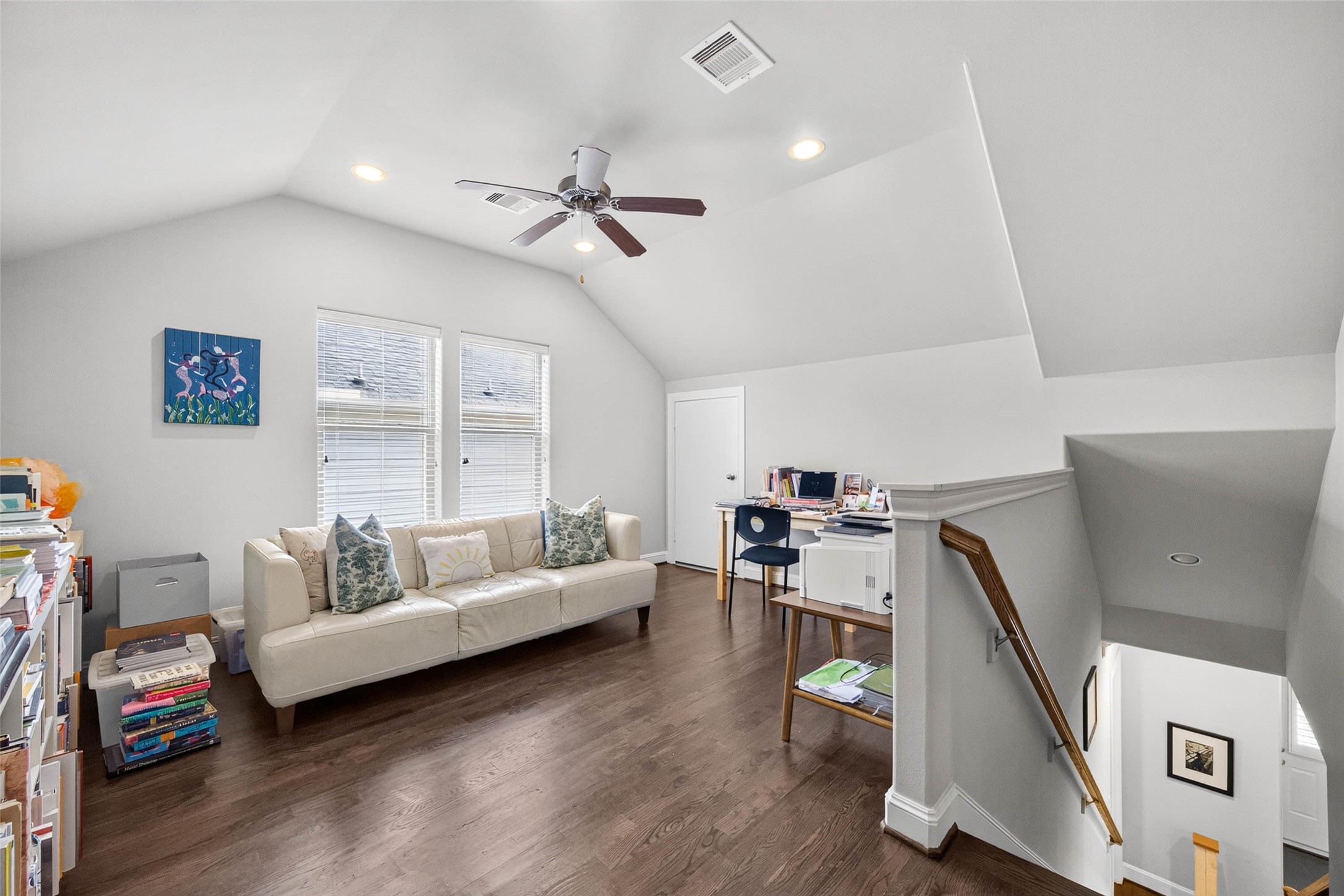 Upstairs, a spacious flex area currently serves as a home office but could easily become a TV room, workout space, or playroom to fit your needs.