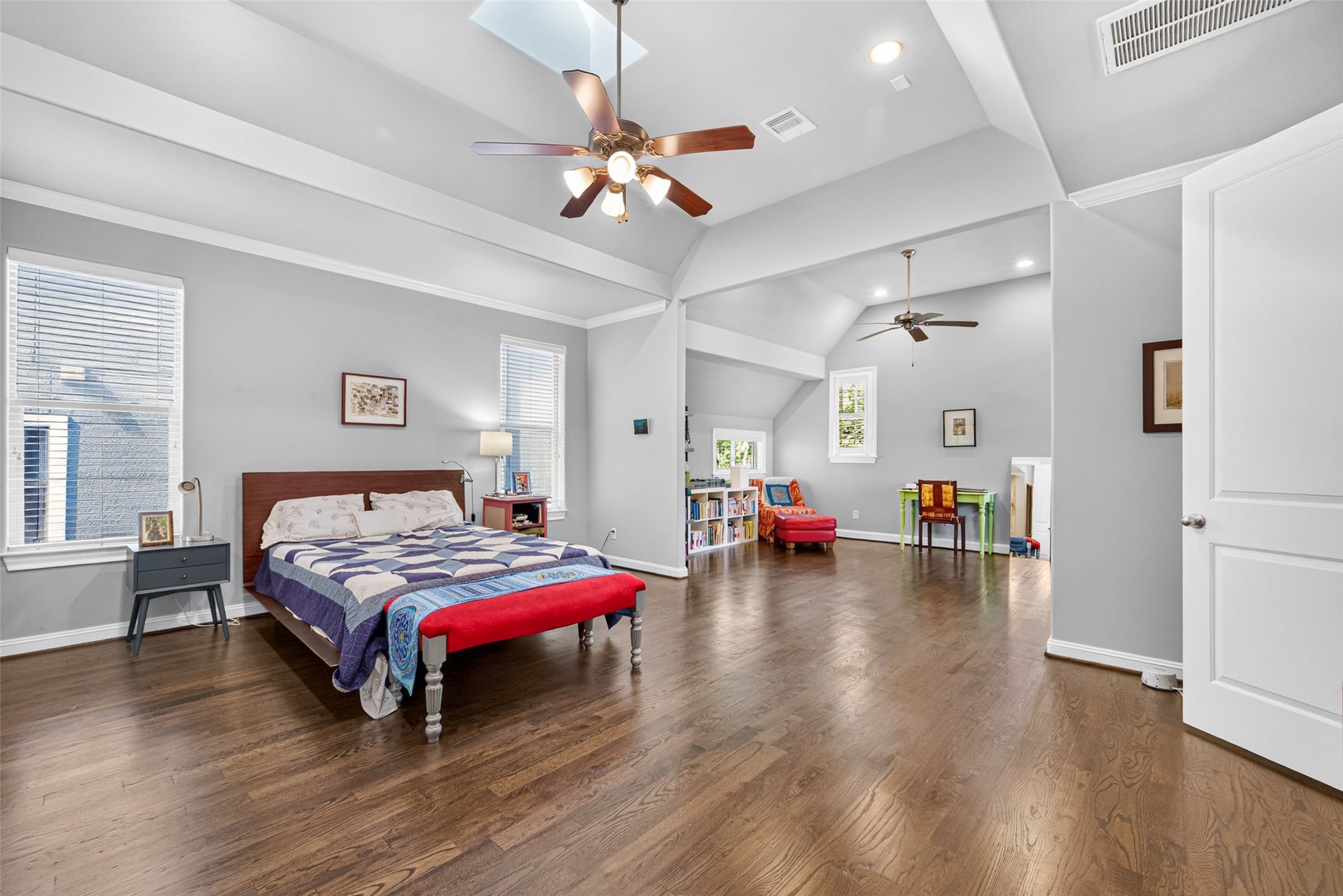 Step into the spacious, light-filled primary bedroom, offering a comfortable and inviting retreat to unwind at the end of the day.