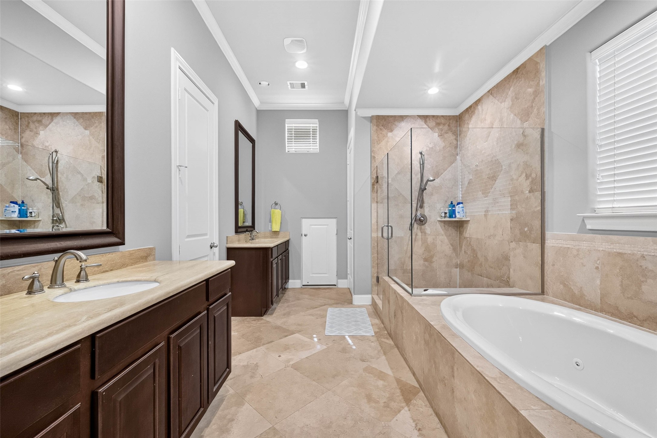 Offering a convenient layout with the walk-in closet located directly within the primary bathroom, keeping everything easily accessible.