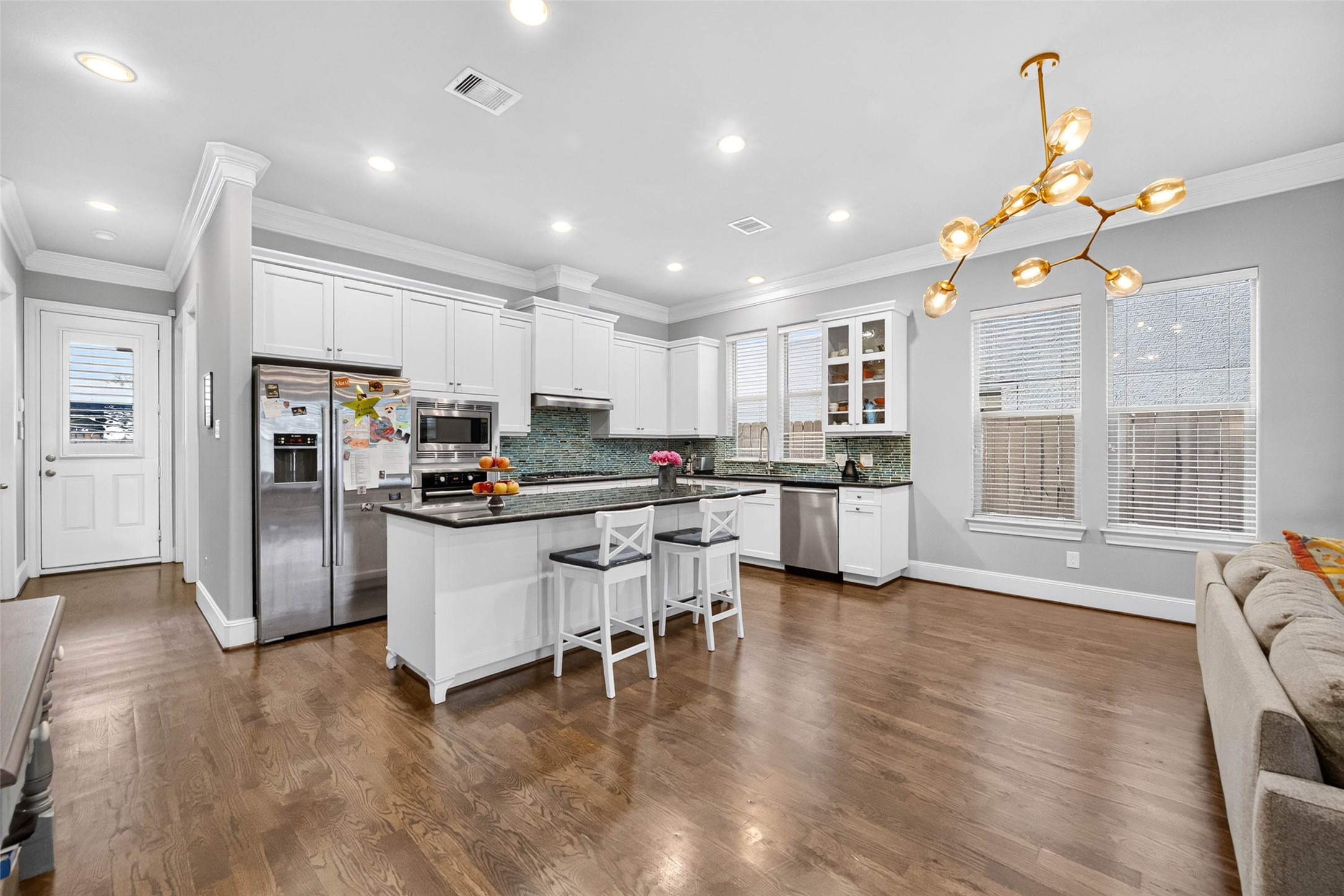 Another perspective of the easy flow between the kitchen and living area, with plenty of flexibility to create a dining nook that suits your lifestyle.