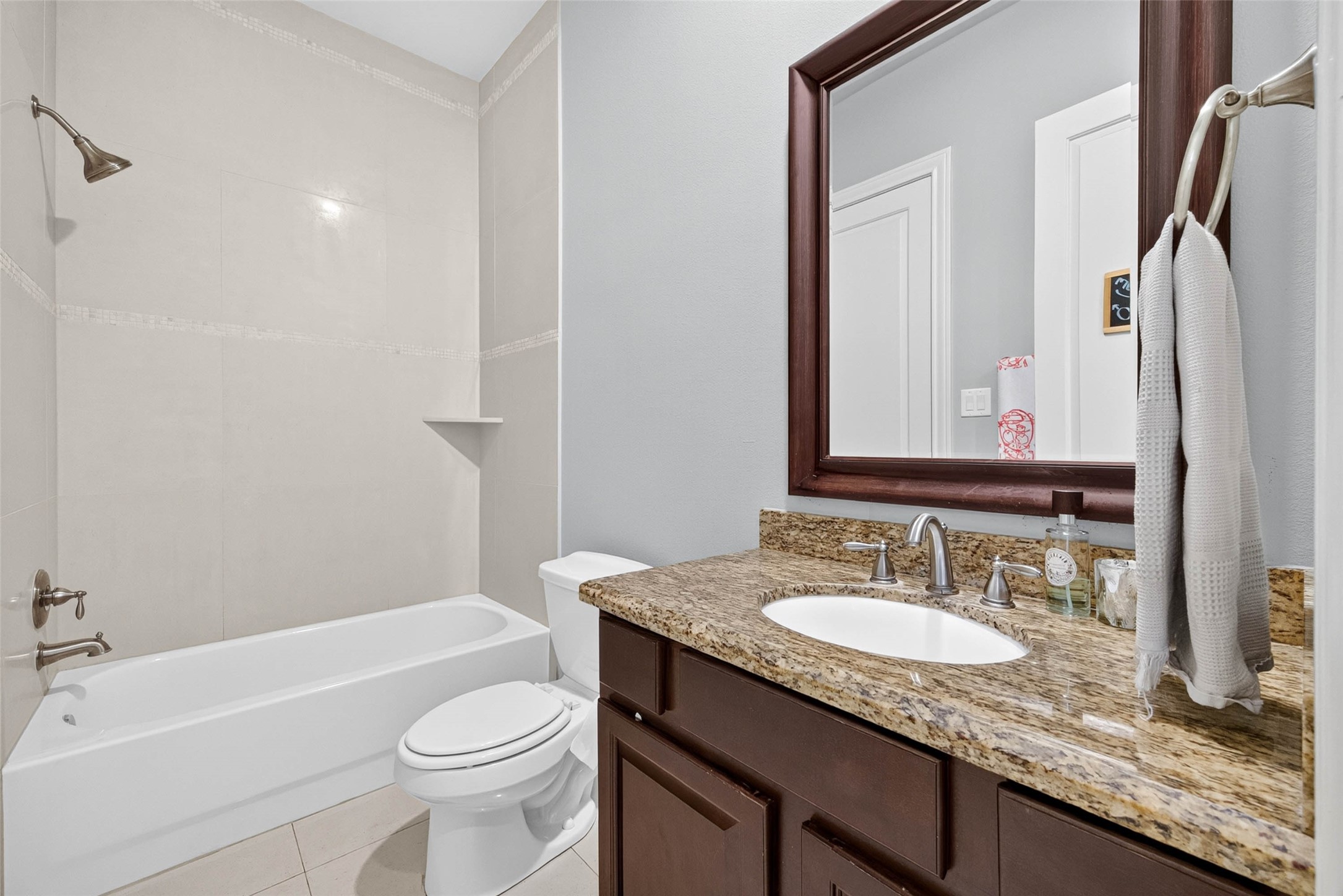 The attached bathroom also opens to the hallway, offering convenient access for both the bedroom and guests.