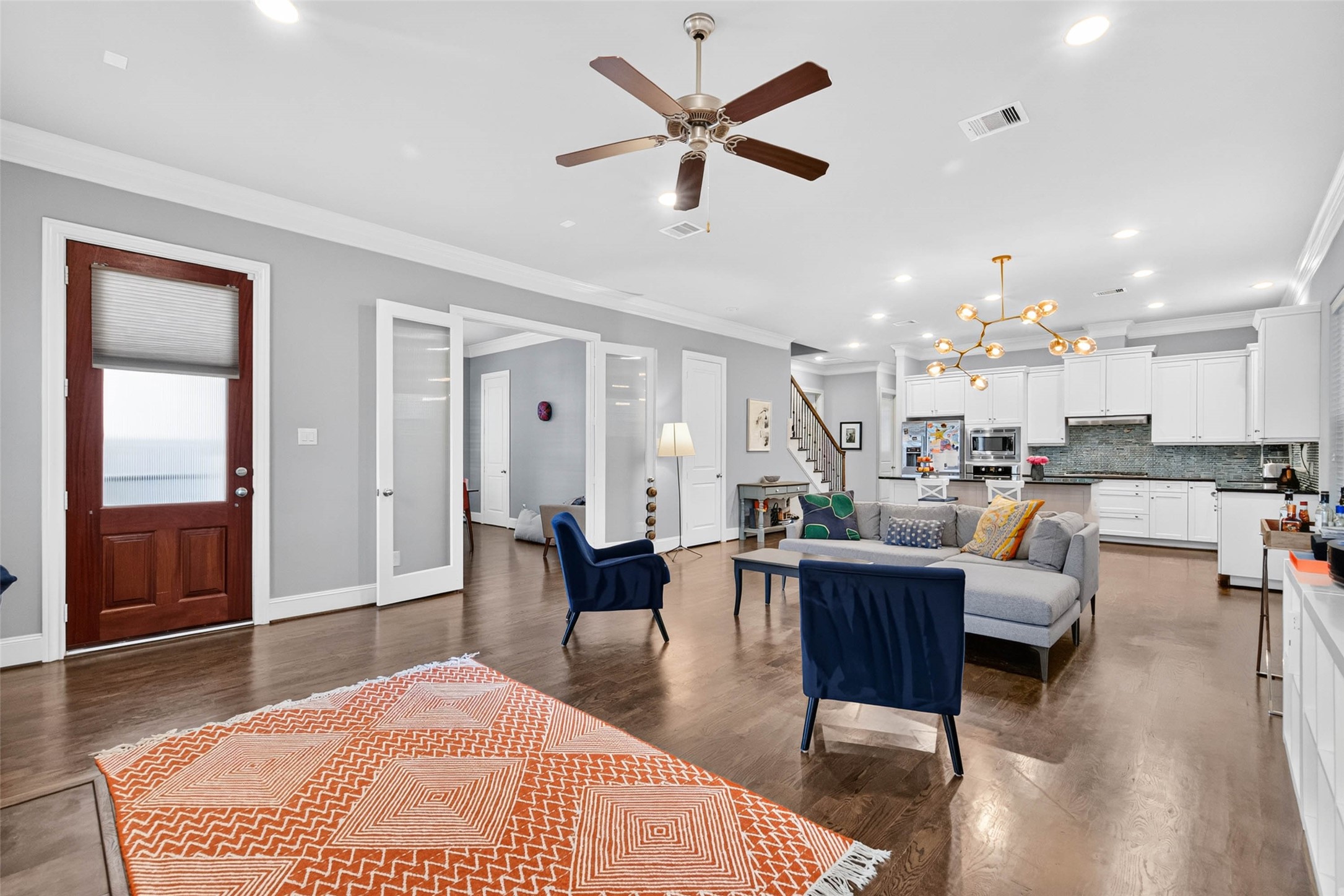 A closer look at the home's thoughtful layout, with the front entry connecting the living room to the kitchen and adjacent dining room.