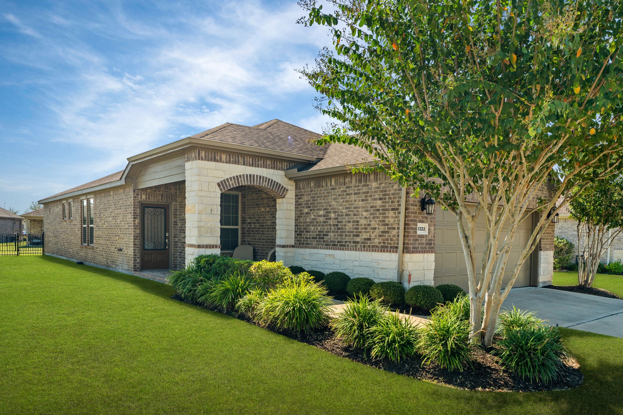 Distinctive brick & stone elevation delivers impressive curb appeal!
