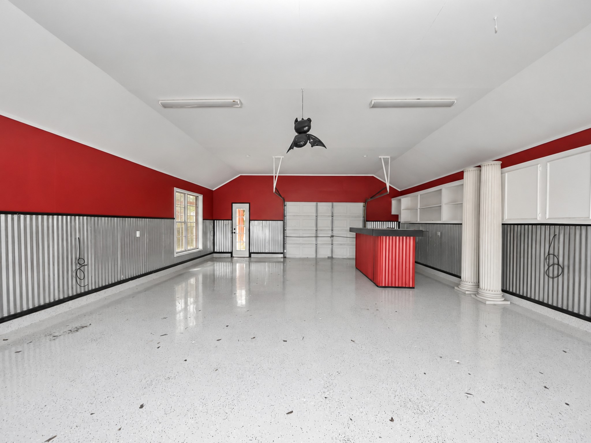 detached Garage that opens up to the pool area and can be used as a small party venue , workshop , car garage and so much more!!