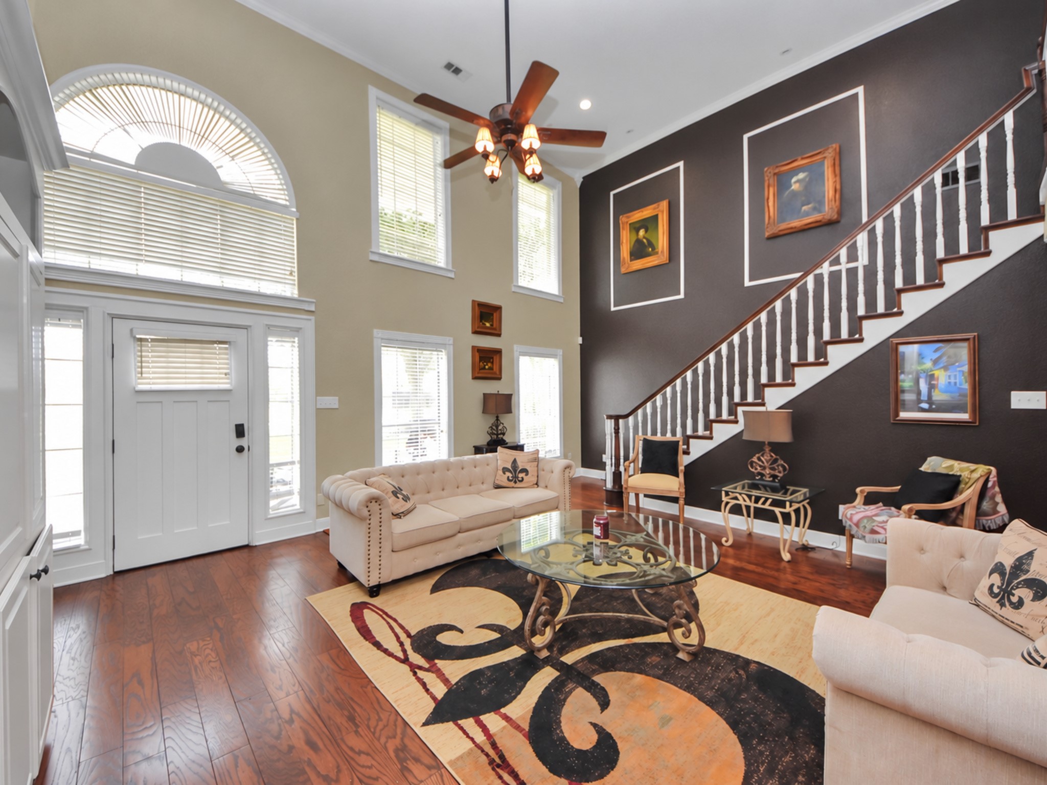 Stunning high ceilings with a beautiful staircase!