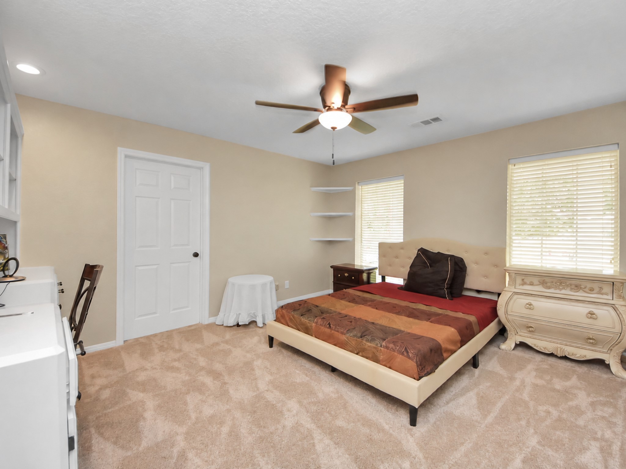 Main house upstairs bedroom #2 with a full closet