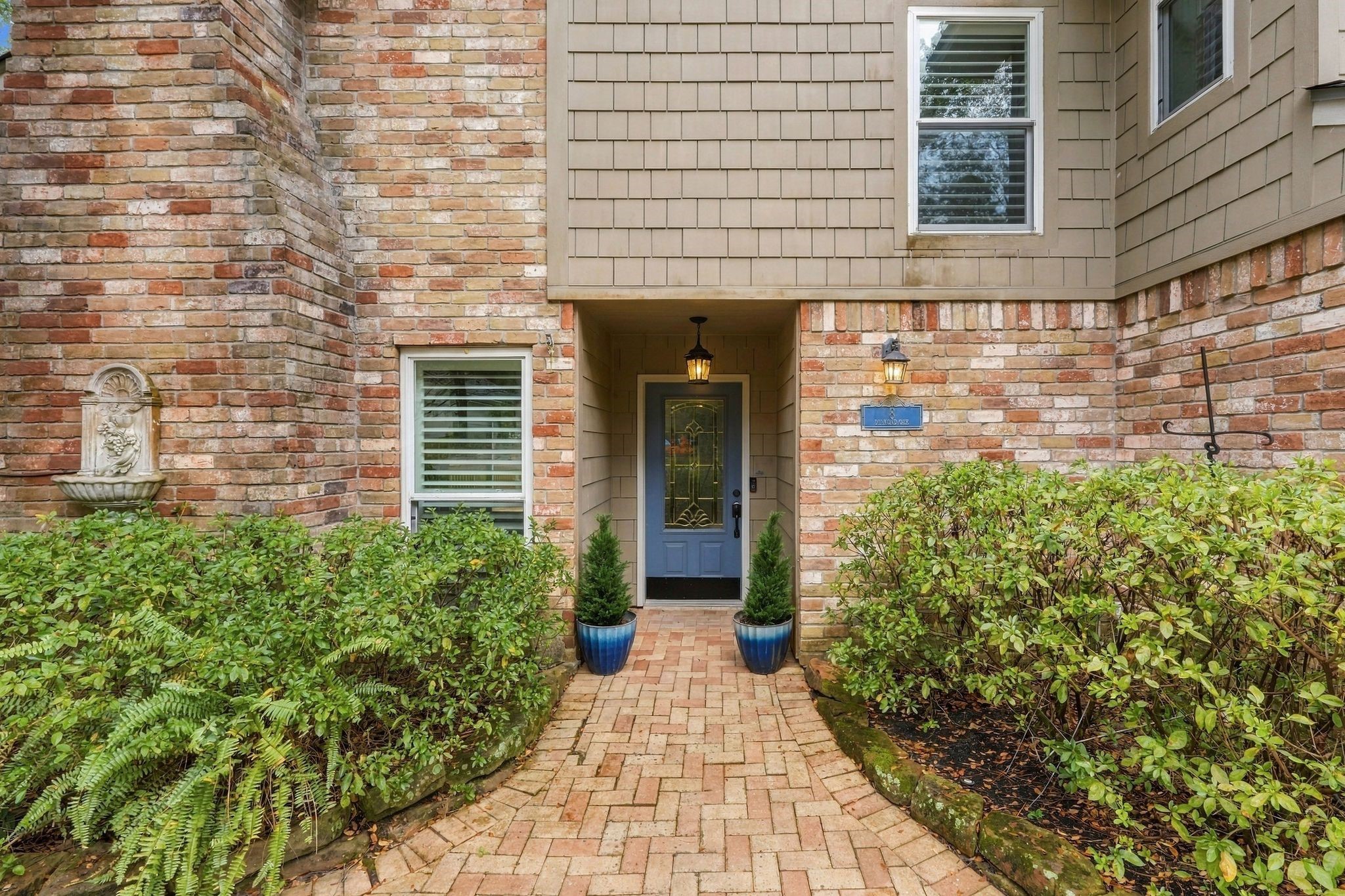 Brick paver pathway leads up to the front entrance surrounded by beautiful well-maintained landscaping. Brick paver pathway leads up to the front entrance surrounded by beautiful well-maintained landscaping.