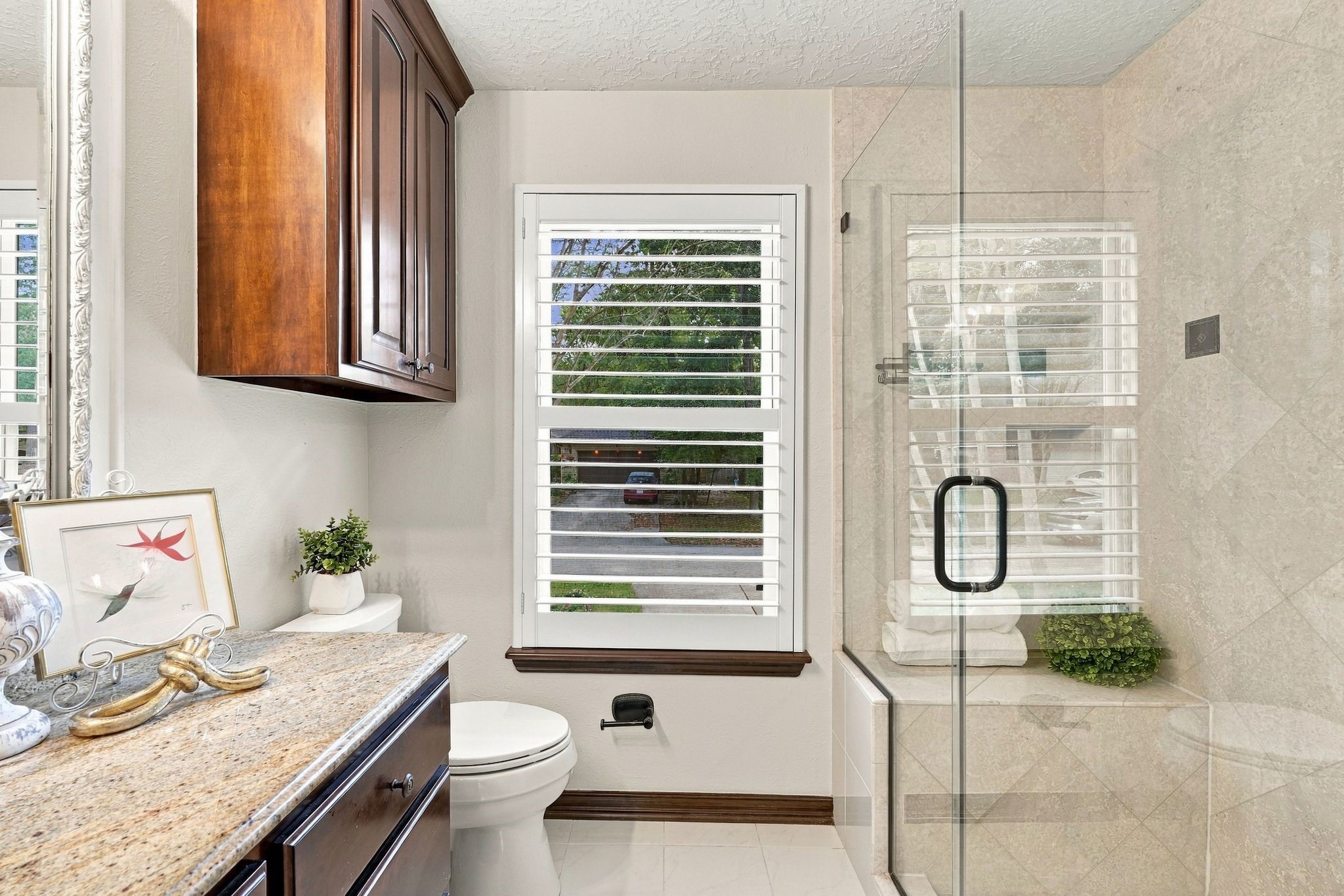 Another view of the primary bathroom with the elegant walk in shower.