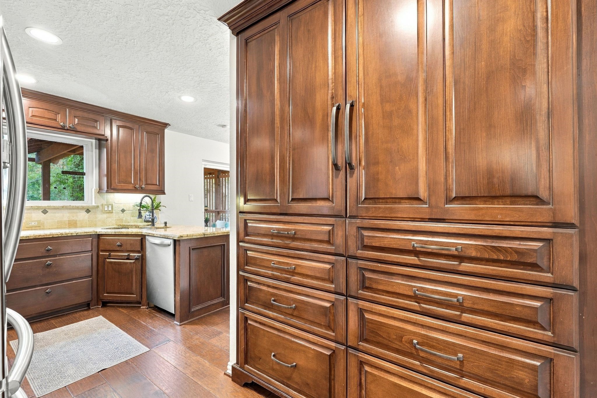 Lovely built in pantry offering generous storage with slideout shelfing.