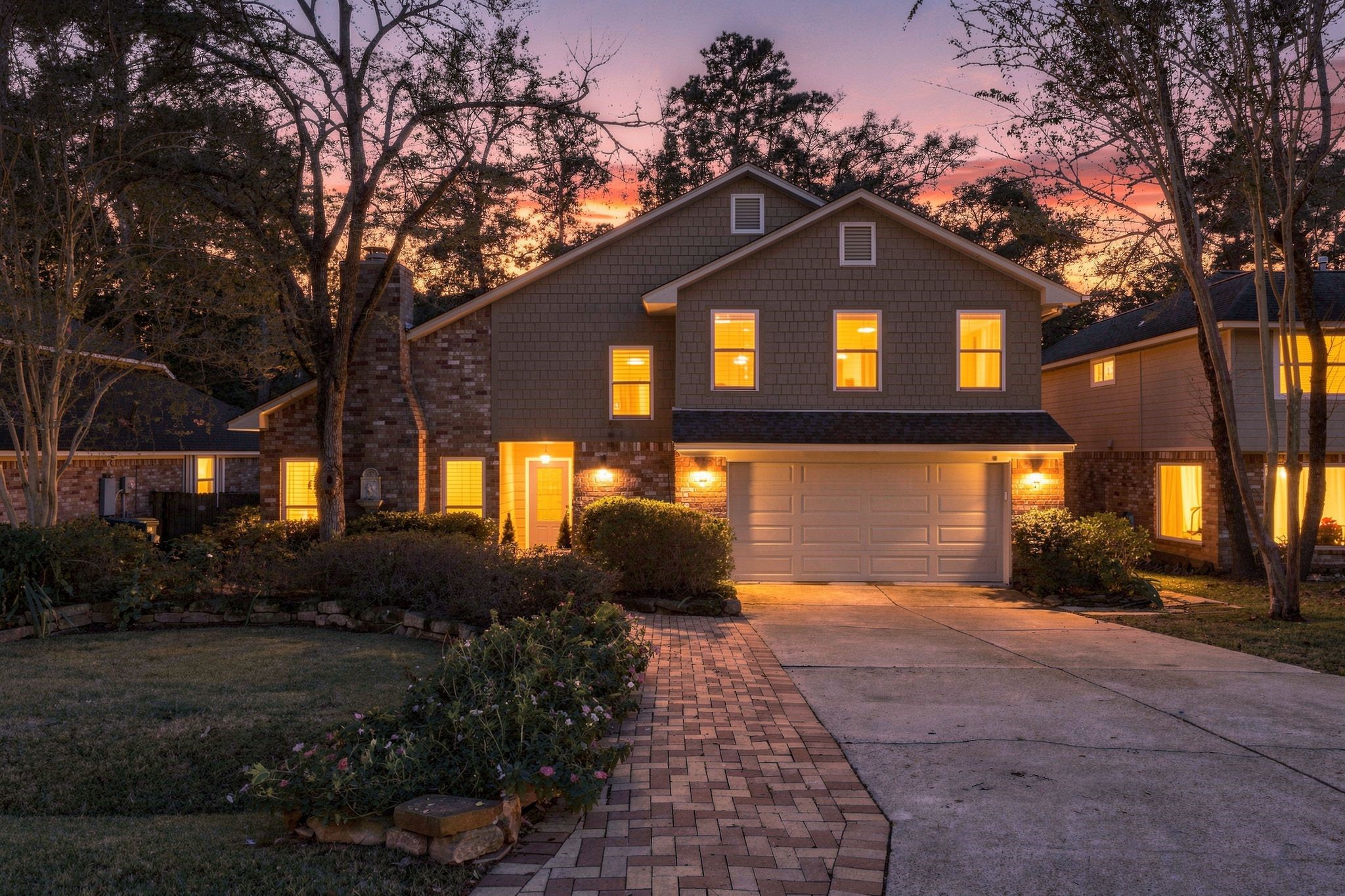 Stunning evening view of the home, showcasing its beautiful exterior and warm, inviting lighting. This could be yours just in time for the Holidays! Stunning evening view of the home, showcasing its beautiful exterior and warm, inviting lighting. This could be yours just in time for the Holidays!