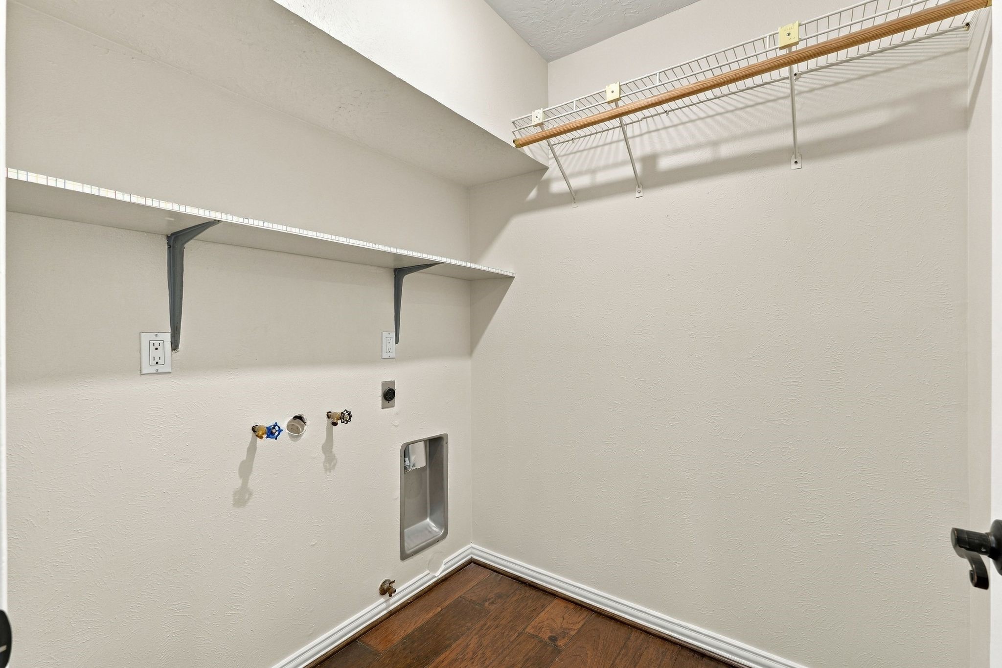 Utility area offering a dedicated space for laundry and everyday household needs.