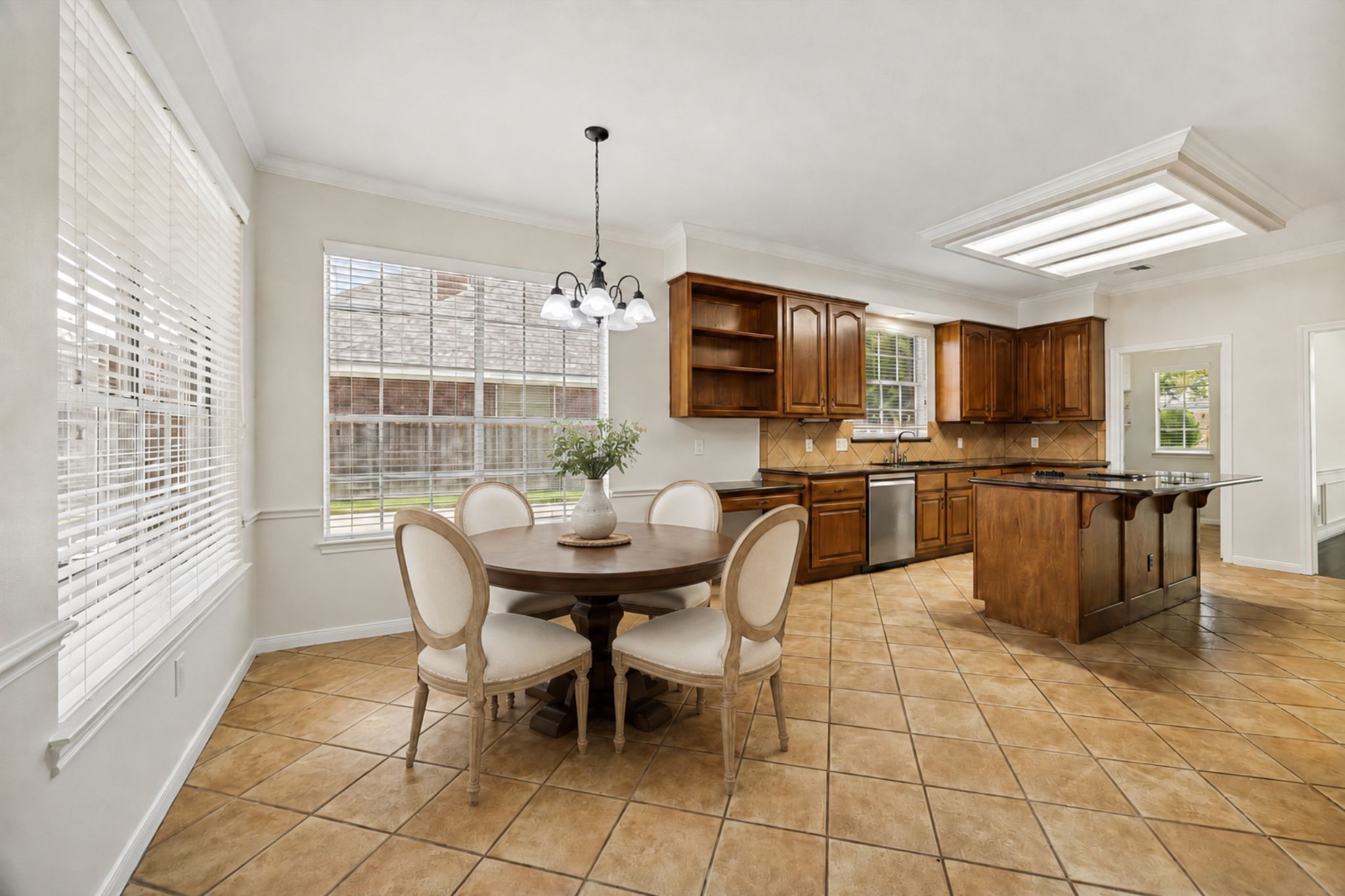 OPEN KITCHEN AND BREAKFAST AREA WITH GENEROUS CABINET STORAGE, AMPLE COUNTER SPACE, AND LARGE WINDOWS BRINGING IN PLENTY OF NATURAL LIGHT.
*Virtually Staged