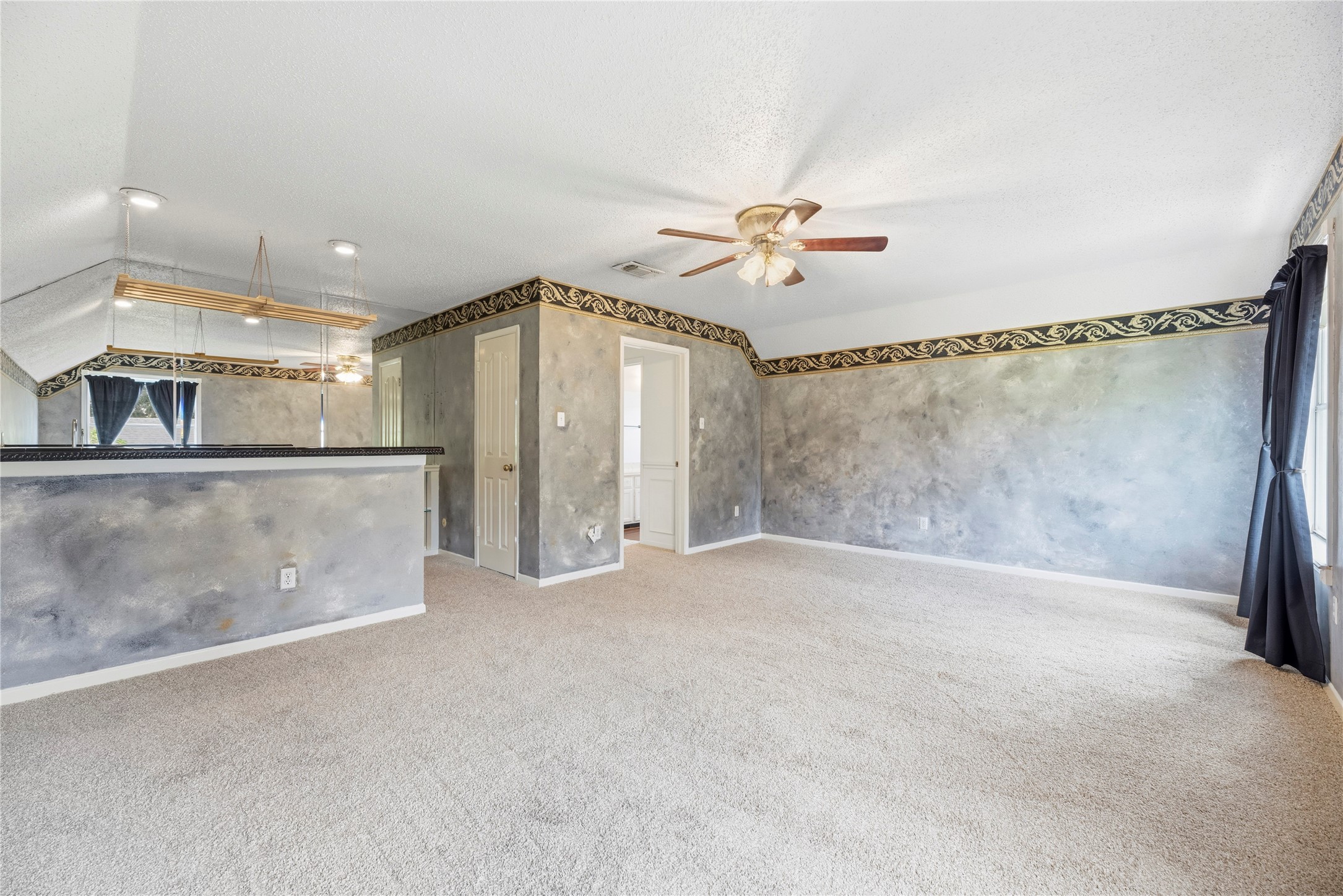 Expansive game room space with a wet bar!