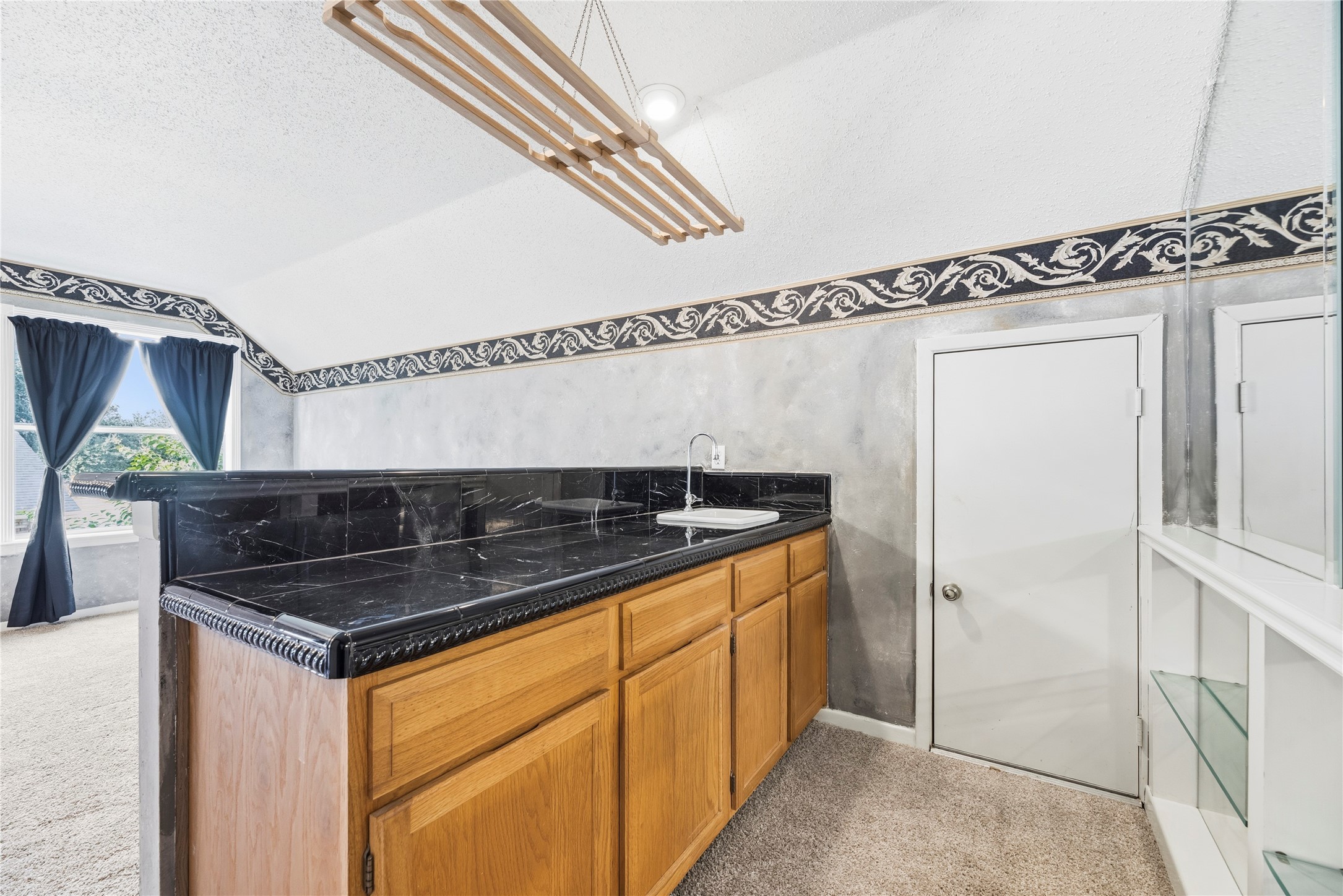 Expansive game room space with a wet bar!